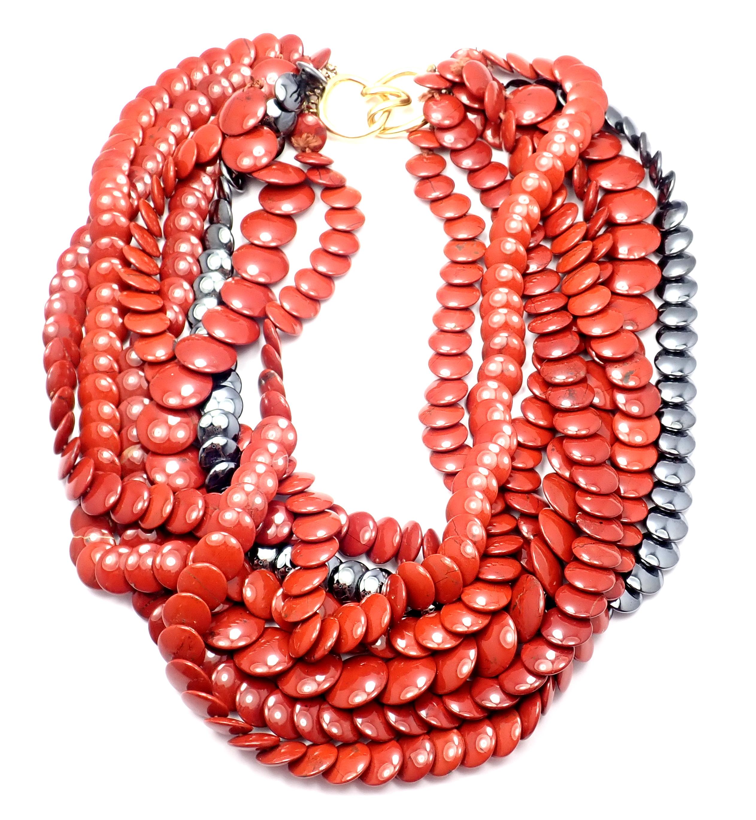 Tiffany & Co 18k yellow gold red jasper and hematite bead, multi strand necklace.
With 6 rows of Jasper beads
1 row of Hematite beads
Details:
Metal: 18k yellow gold
Length: 18 inches
Weight: 259.7 grams
Hallmarks: Tiffany & Co 18k
YOUR PRICE: