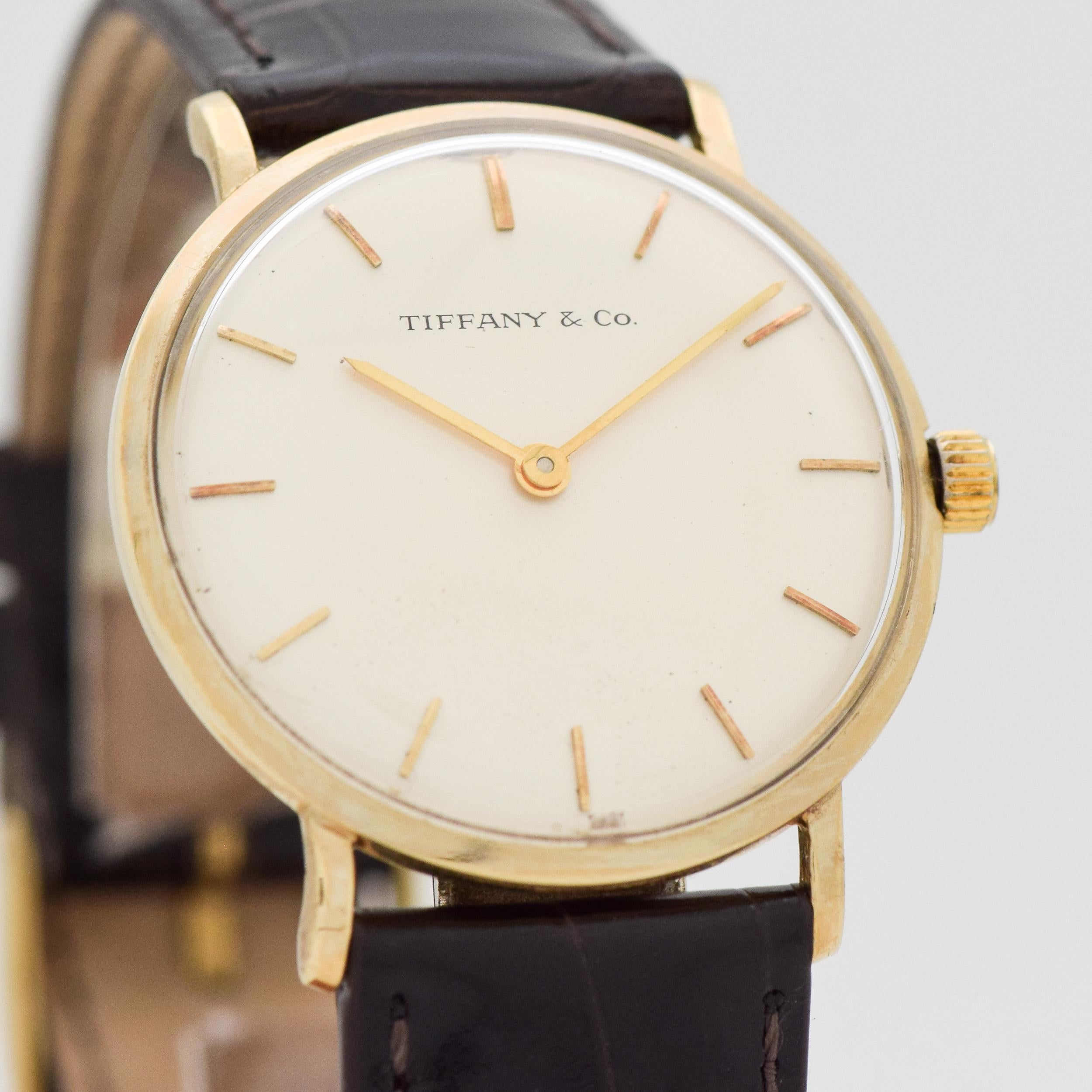 1994 Tiffany & Co. Ref. T 101-C 14K Yellow Gold Watch Rare Tiffany & Co, Recognition of 25 Years of Service with Tiffany & Co. watch Original Silver Dial with Applied Gold Stick Markers. 33mm x 36mm lug to lug (1.3 in. x 1.42 in.) - 17 jewel, manual