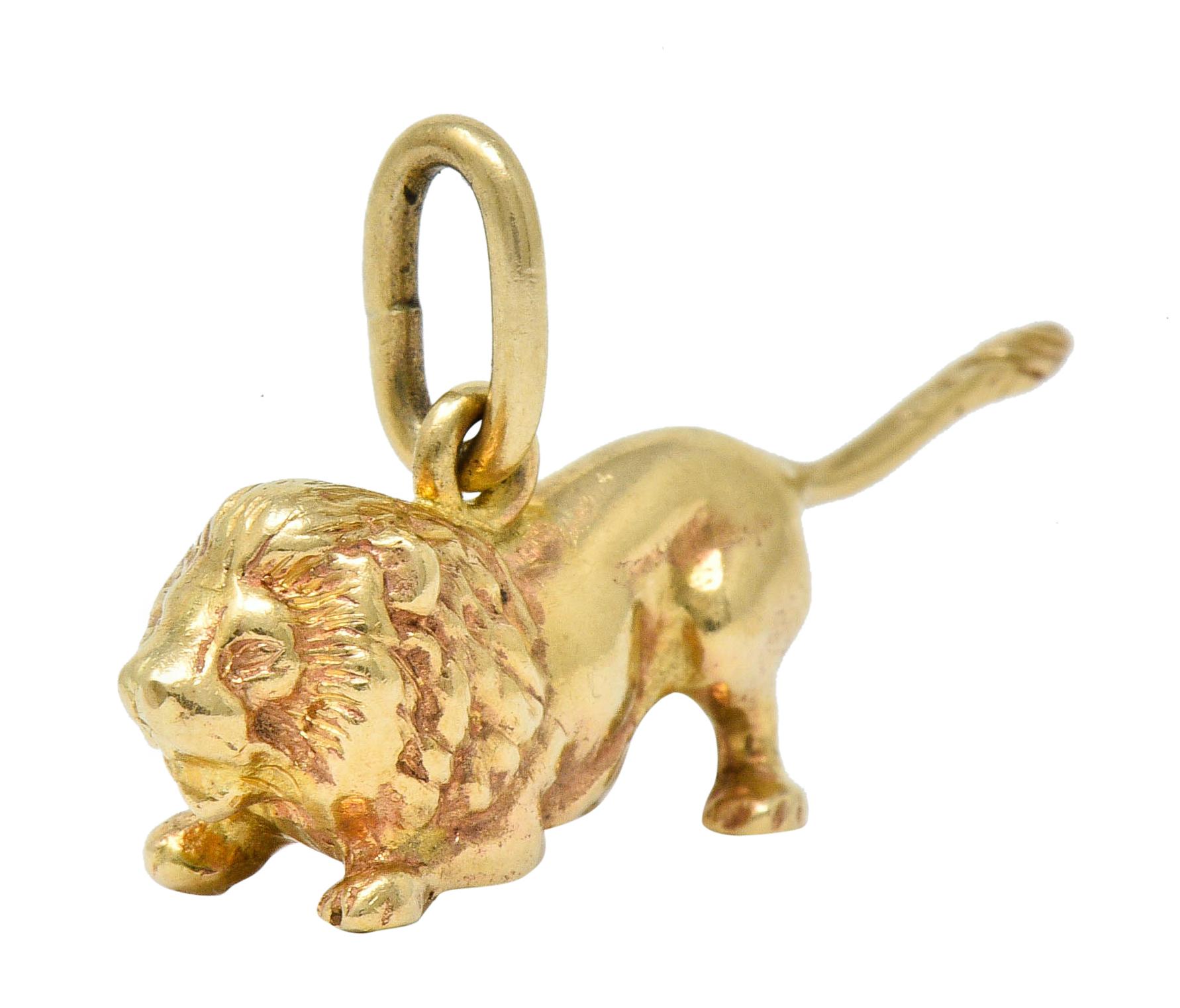 Designed as a crouching lion with an erect tail and a roaring countenance

With highly rendered details and a bright polish

Stamped 14K for 14 karat gold

Fully signed Tiffany & Co.

Circa: 1940s

Measures: 5/8 x 1 1/8 inches

Total weight: 4.3