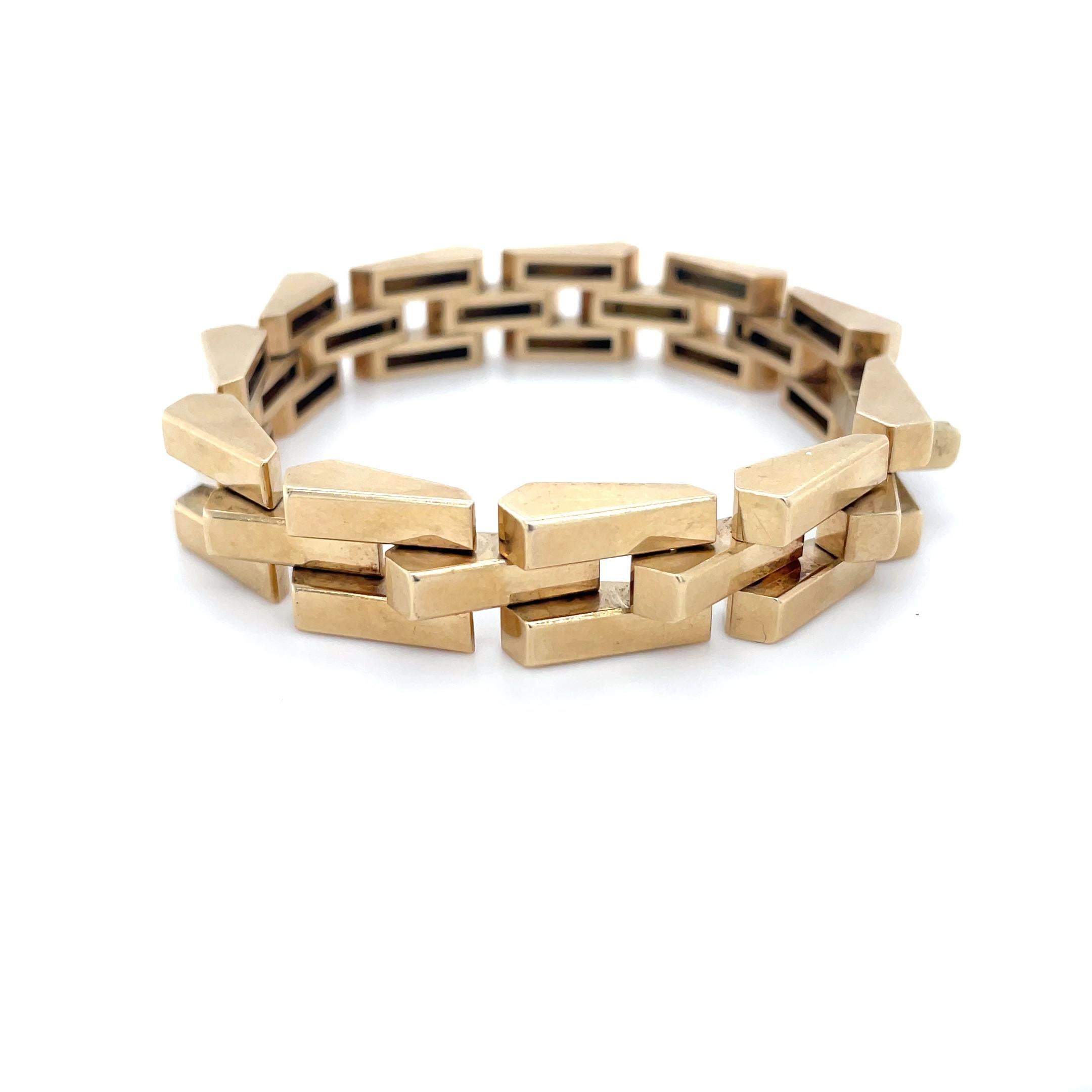 This vintage bracelet designed by Tiffany & Co. features a three-row design with rectangular links. Skillfully crafted, this bracelet is comfortable and perfect for everyday wear!

Measurements: 7 inches long
Metal: 14 karat yellow gold
Stamp: