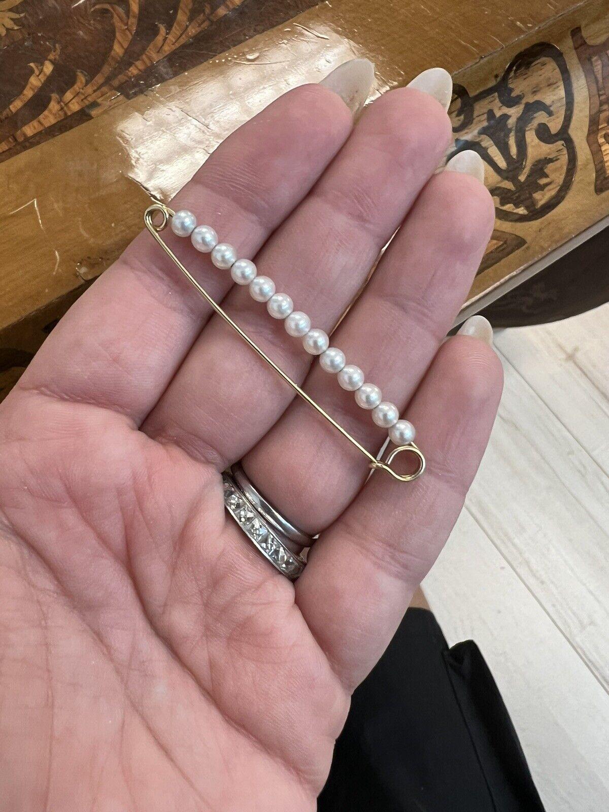 Tiffany & Co. Retro 14k Yellow Gold & Pearl Safety Pin Circa 1950s

Here is your chance to purchase a beautiful and highly collectible designer safety pin.  

The length is 2.25 inches.  The pearls are 1/8 of an inch.  The piece is hallmarked.  