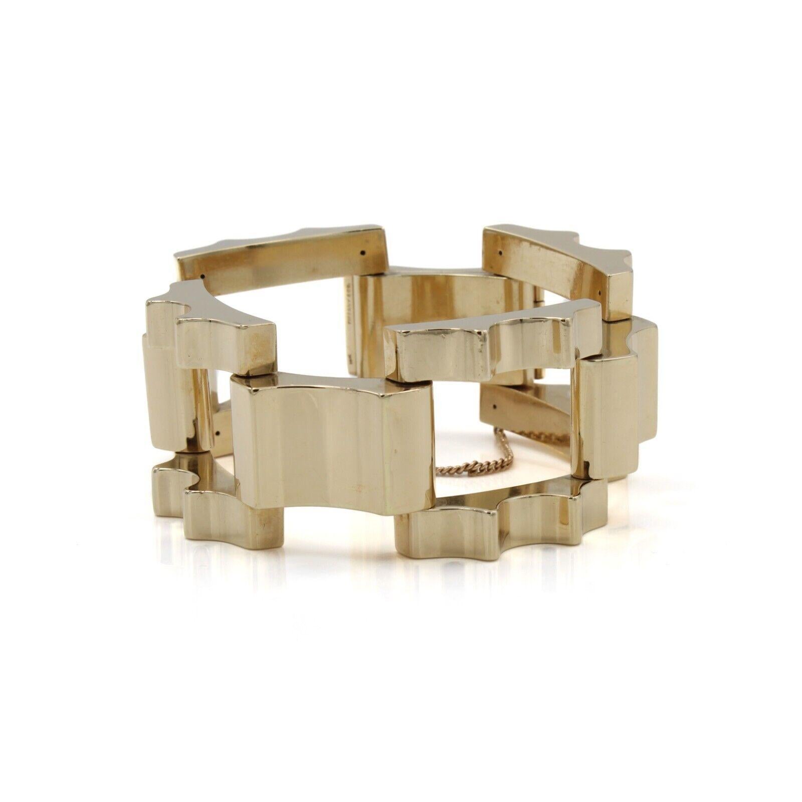 Tiffany & Co. Retro 14k Yellow Gold Tank Bracelet Circa 1950s

Here is your chance to purchase a beautiful and highly collectible designer bracelet.  
 
Indulge in timeless elegance with the Tiffany & Co. 14k yellow gold retro tank bracelet,