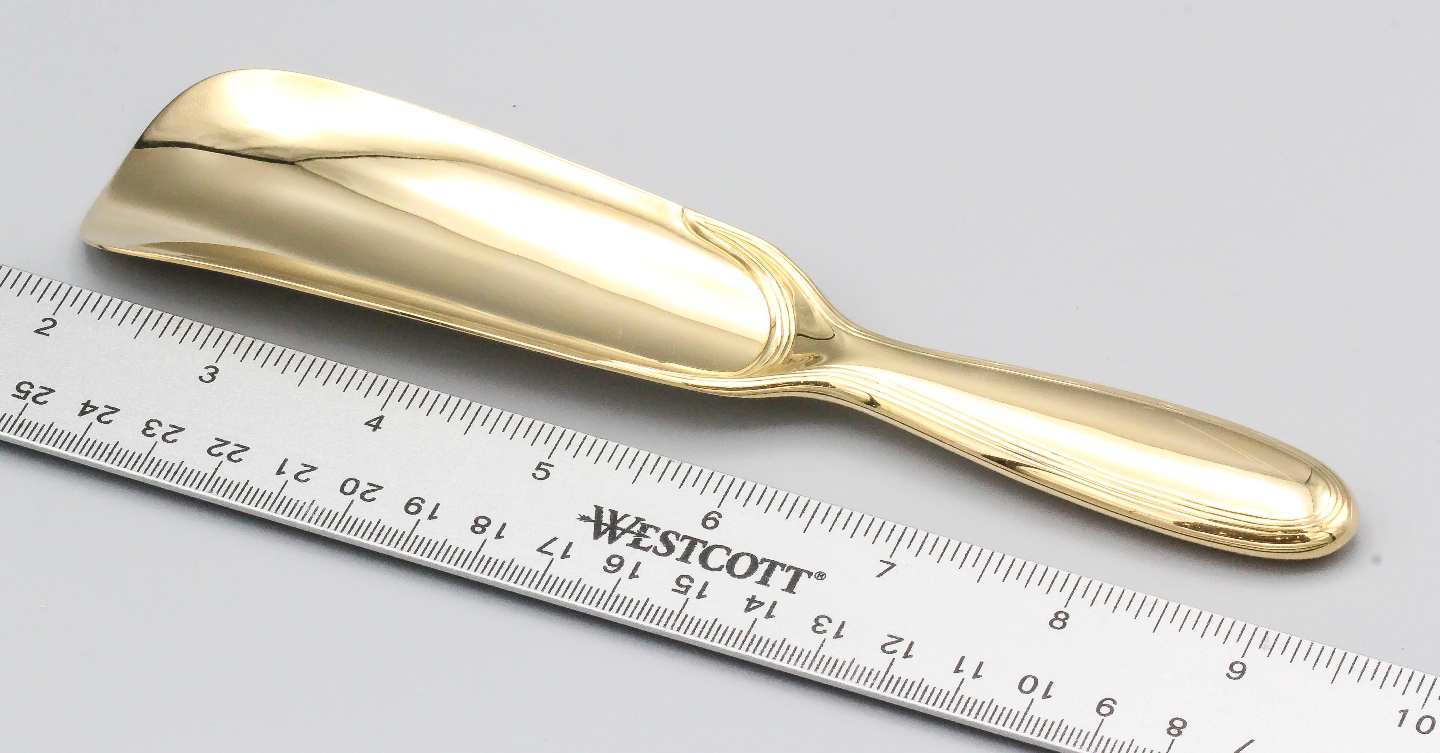 Rare solid 18K yellow gold shoehorn by Tiffany & Co.  circa 1940s.  Beautifully made and highly functional, a great gift for the modern affluent gentleman.

Hallmarks: Tiffany & Co. Makers, 18kt Gold, reference numbers, maker's mark.