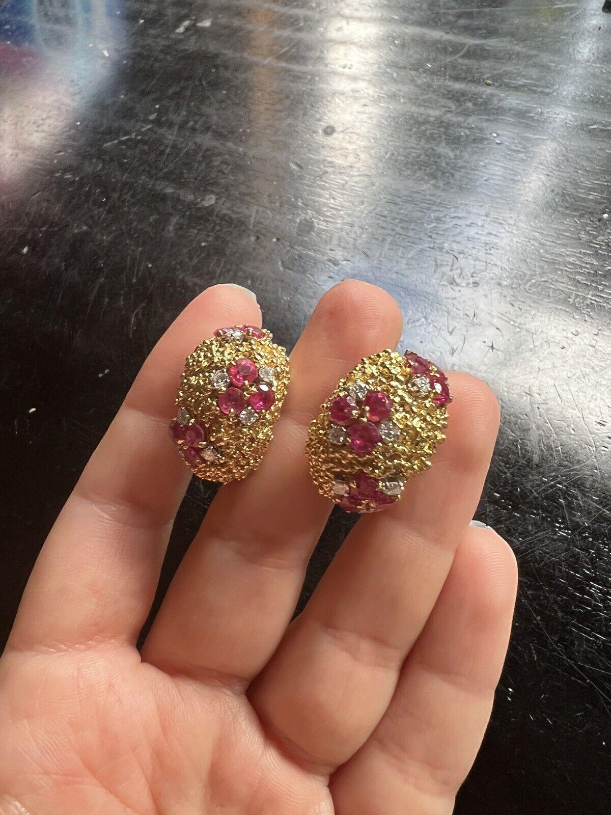Tiffany & Co. 18k Hammered Yellow Gold, Ruby & Diamond Earrings Retro Circa 1950s

Here is your chance to purchase a beautiful and highly collectible designer pair of earrings.  Truly a great piece at a great price! 

Weight: 28.6 grams

Condition:
