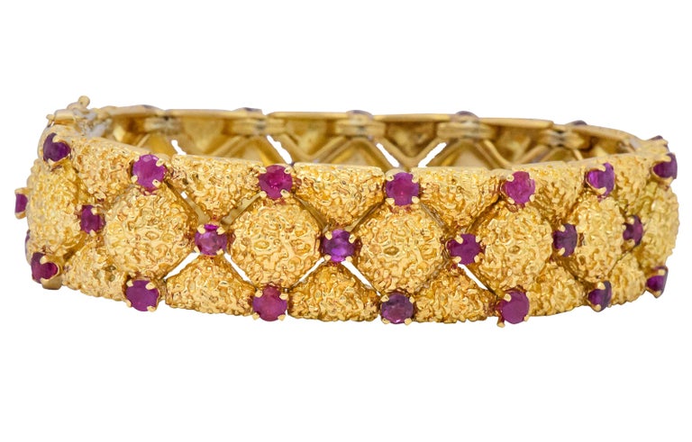Designed as textured gold links with argyle spacing and prong set ruby accents

Set throughout with rubies weighing approximately 3.60 carats total

Completed by concealed clasp and double fold-over safeties

Fully signed Tiffany & Co. and stamped