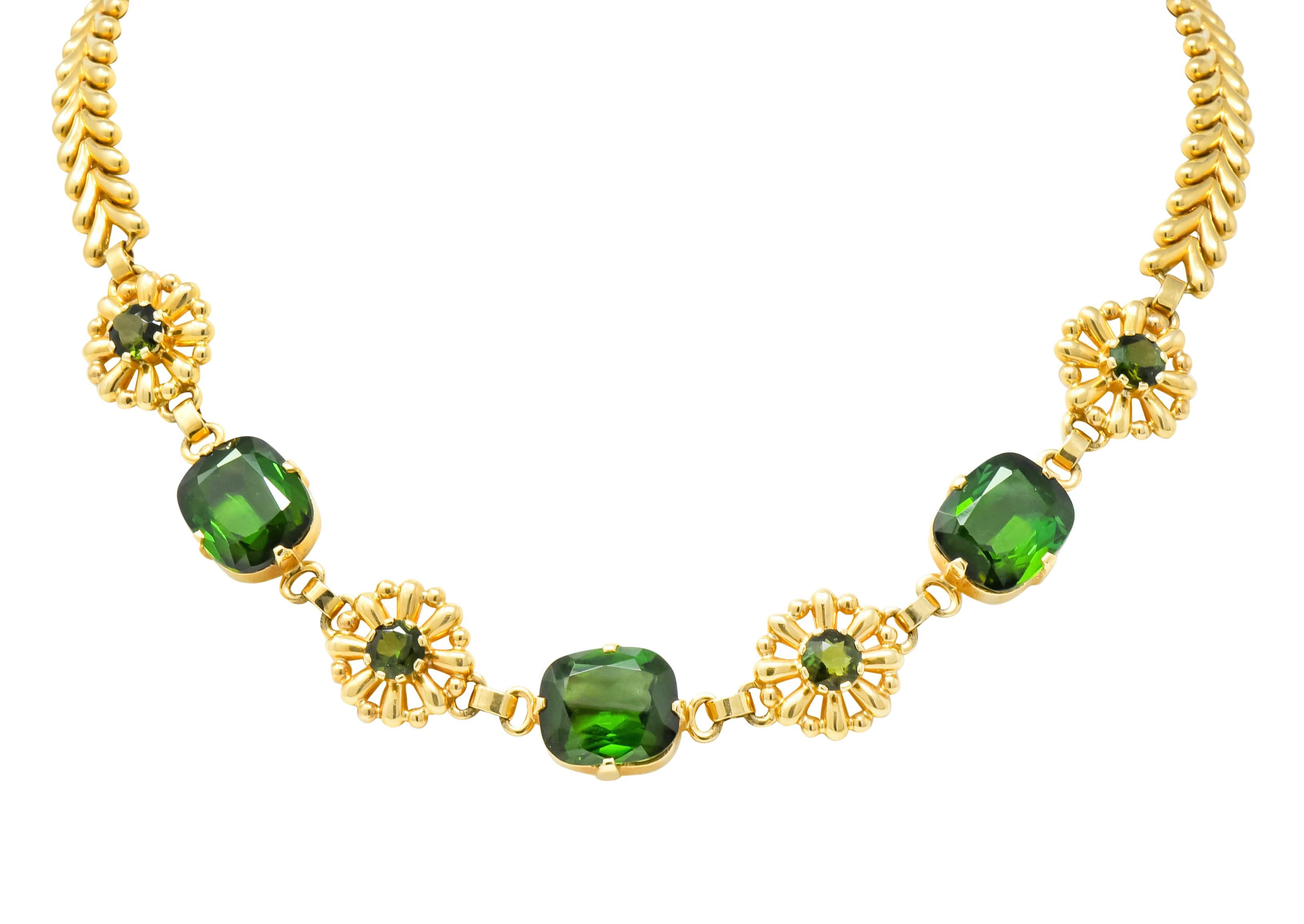 Bracelet and Necklace both feature highly polished flower links centering round cut tourmaline alternating with prong set mixed cushion cut tourmaline

Tourmaline is transparent and a deeply saturated forest green weighing in total approximately