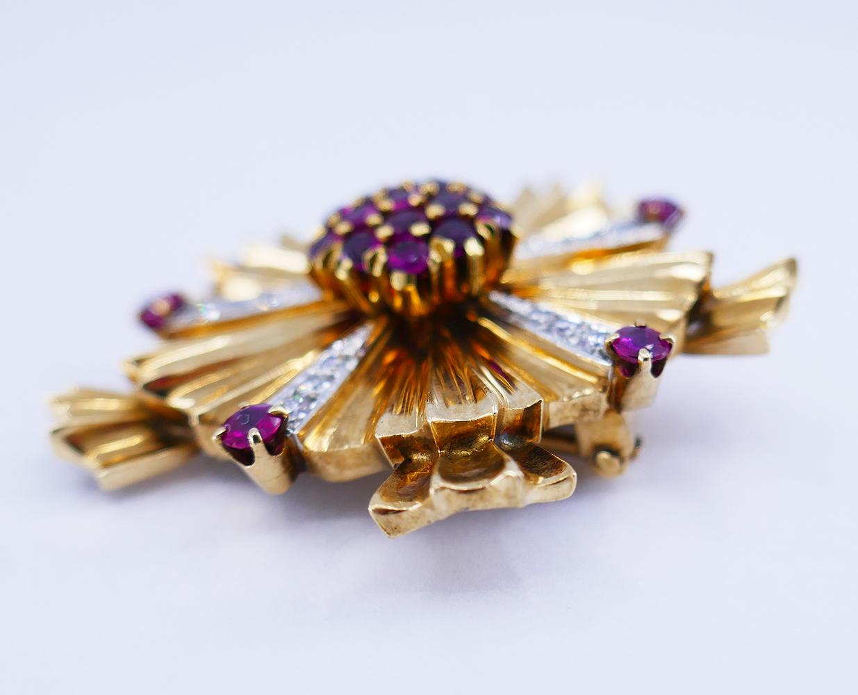 	A Tiffany & Co. Retro ruby and diamond pin brooch made of 14 karat gold.
	This starburst motif Retro Tiffany brooch is crafted of corrugated gold. This technique was very common in the 1940s when this retro gold brooch was created.
	The rubies are