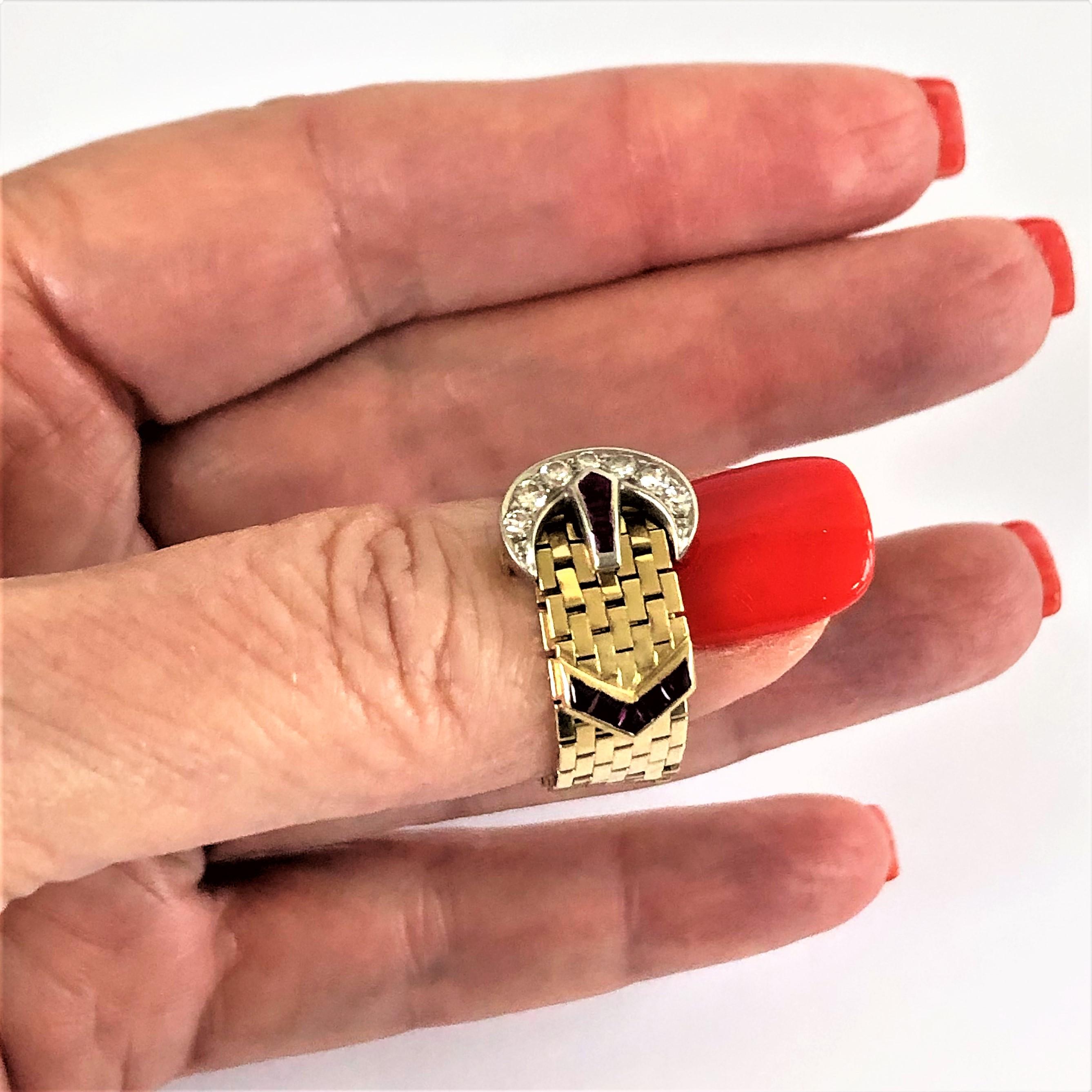This lovely 14K yellow gold buckle ring was made by Tiffany & Co in the 1940s.
The six diamonds set into the buckle weigh an approximate total of .20CT. The natural 
rubies add a wonderful touch of color to the ring. Measures 3 1/4 inches long by