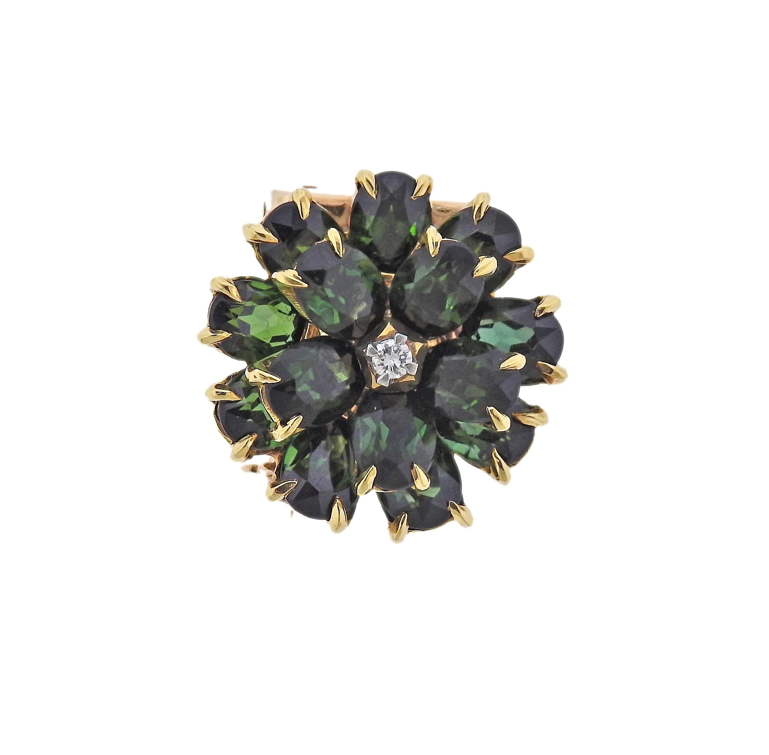 Retro 14k gold flower brooch by Tiffany & Co, with green tourmalines and approx. 0.03ct G/VS diamond in the center. Brooch is 20mm in diameter. Marked: Tiffany & Co. Weight 9.4 grams.