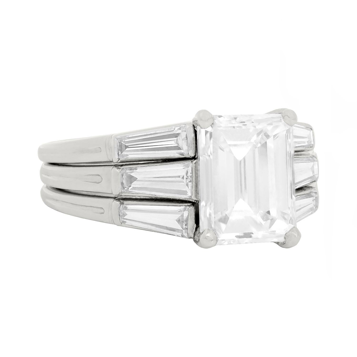 A simply outstanding diamond engagement ring from the Retro (ca1940) era by the famed maker Tiffany & Co.! This beautiful ring is made of platinum and holds a gorgeous Emerald Cut diamond at the center. The diamond, which is prong set, has I color