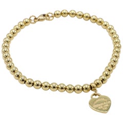 Tiffany & Co. zurück zu Tiffany 18 Karat Gold Mini Heart Tag Bead Bracelet