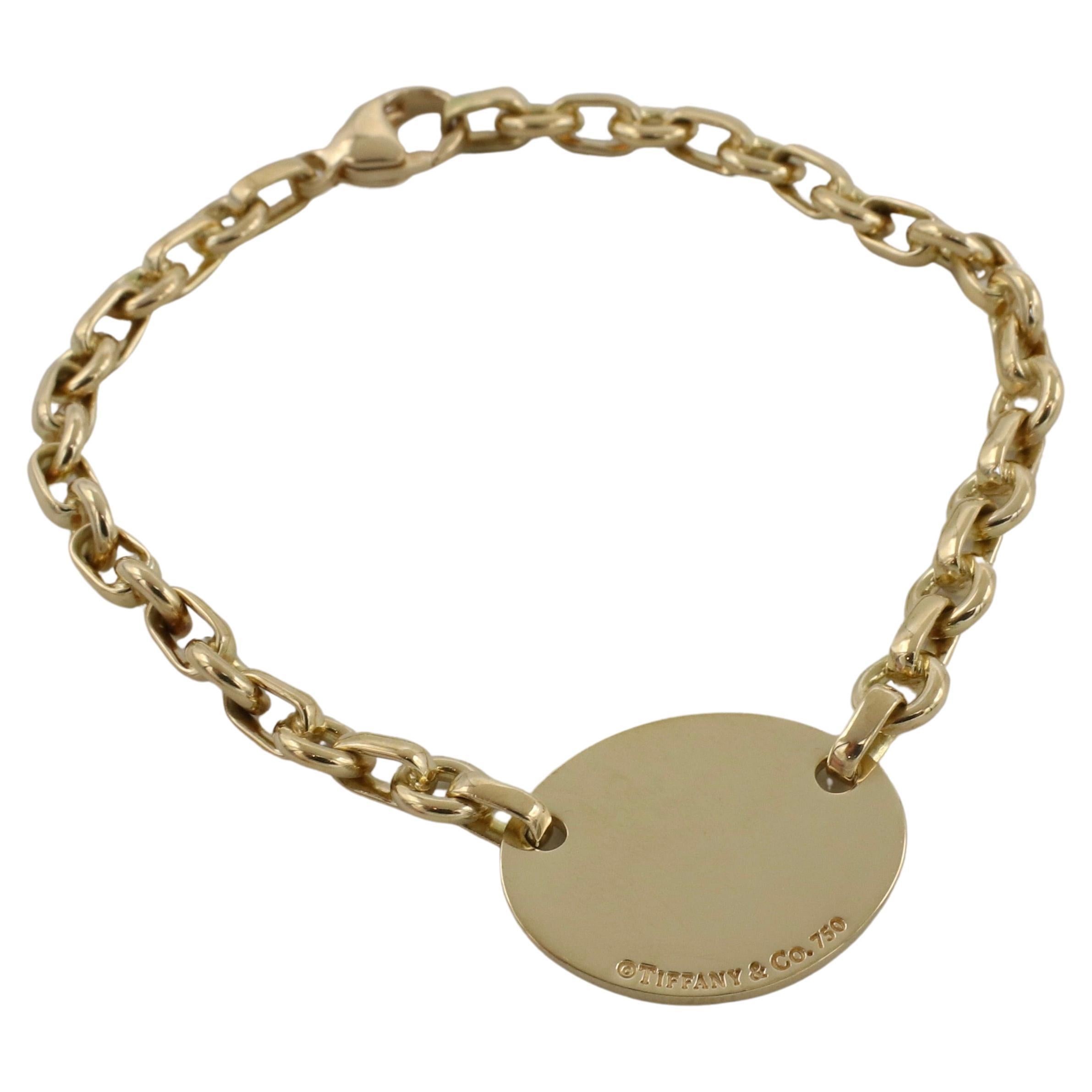 Tiffany & Co. Return To Tiffany 18 Karat Yellow Gold Chain Link Bracelet
Metal: 18k yellow gold
Weight: 20.5 grams
Length: 7 inches
Tag: 22.5 x 18mm
Signed: PLEASE RETURN TO TIFFANY & CO. NEW YORK 750 ©TIFFANY & CO. 750
Links: 6mm
