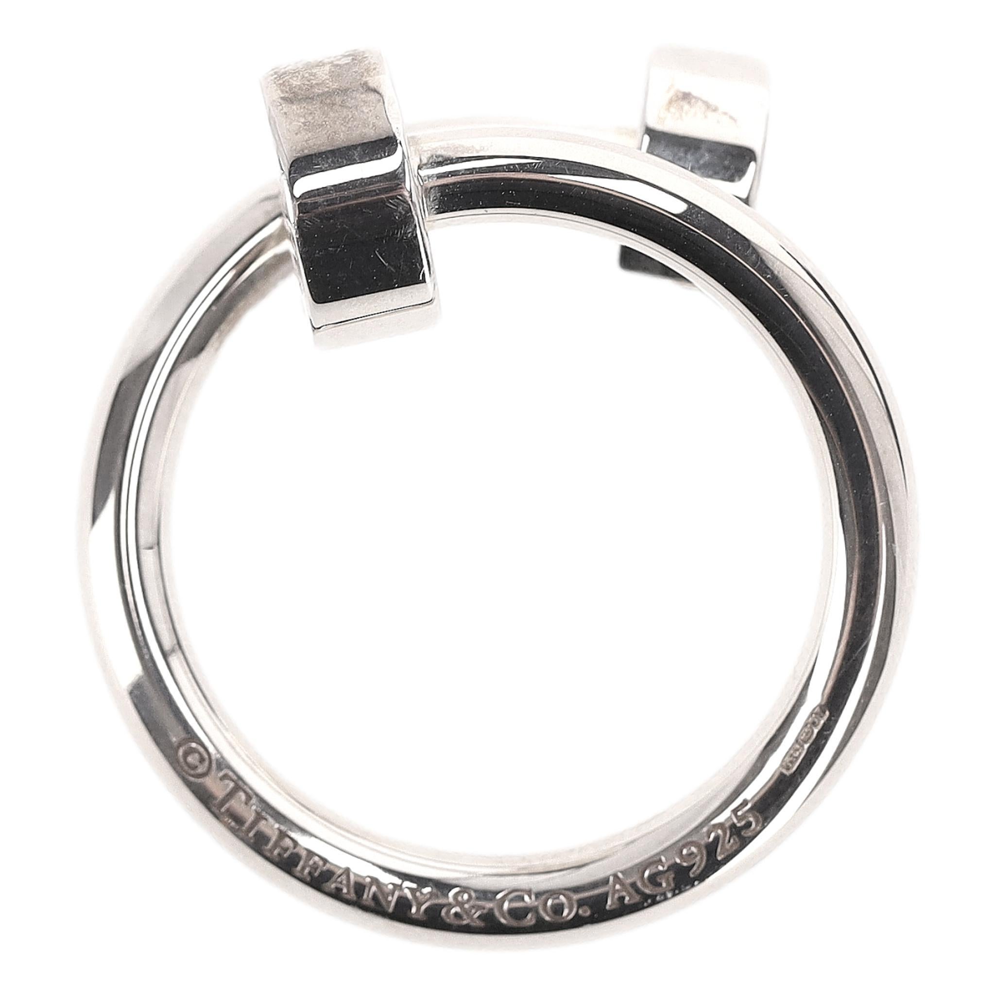 Rare Item - Tiffany & Co. 'Return To Tiffany' 925 Sterling Silver Keyring 

Overlap Circle, designed like a bangle style keyring crafted from 925 sterling silver.

Featuring signature engravement to the ring and iconic 'Please Return To Tiffany &