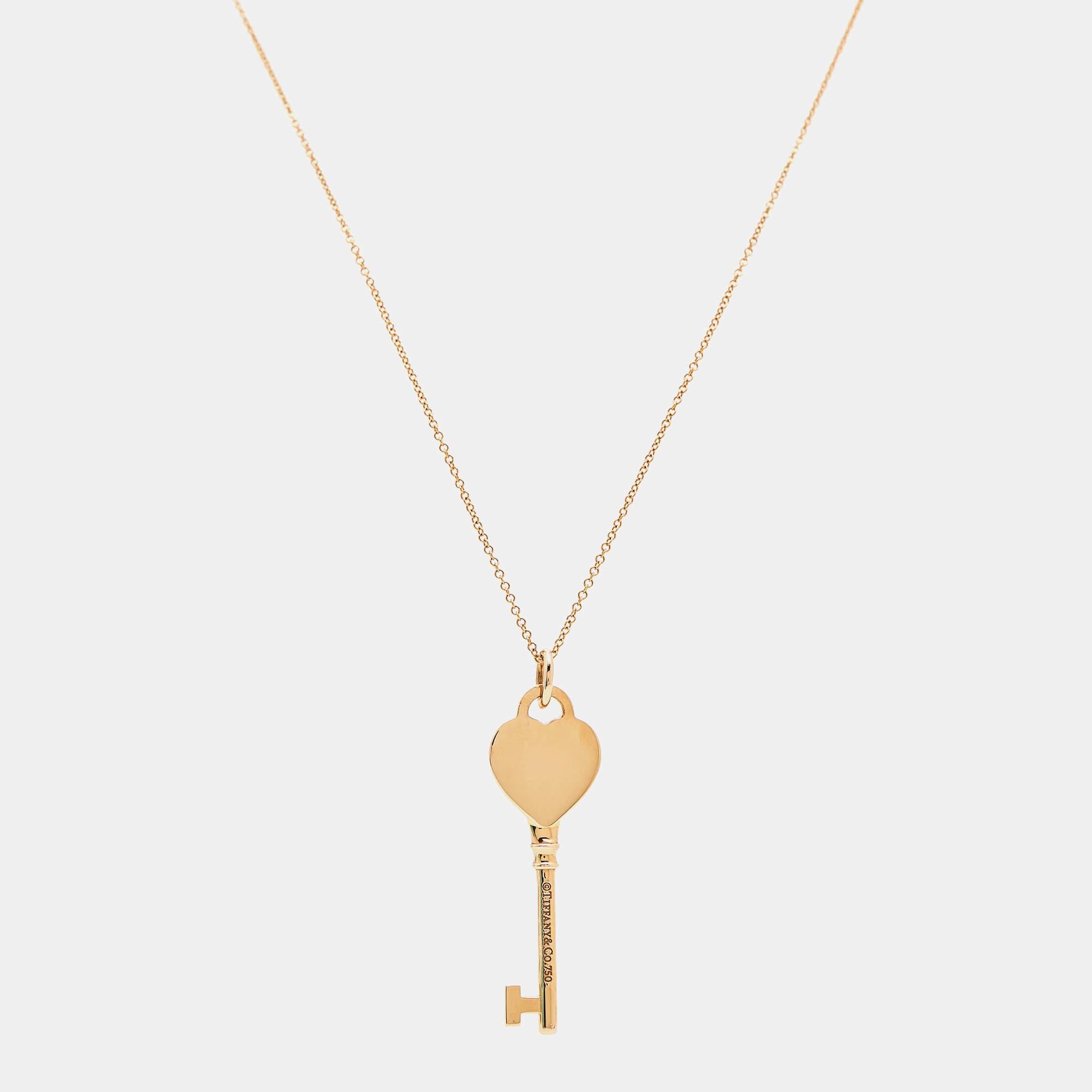 This Tiffany & Co. necklace is from the famous collection titled Return To Tiffany. The piece is made from 18K rose gold and shaped as a key with neat engravings of the collection. Held by a delicate chain with a spring ring clasp, this necklace,