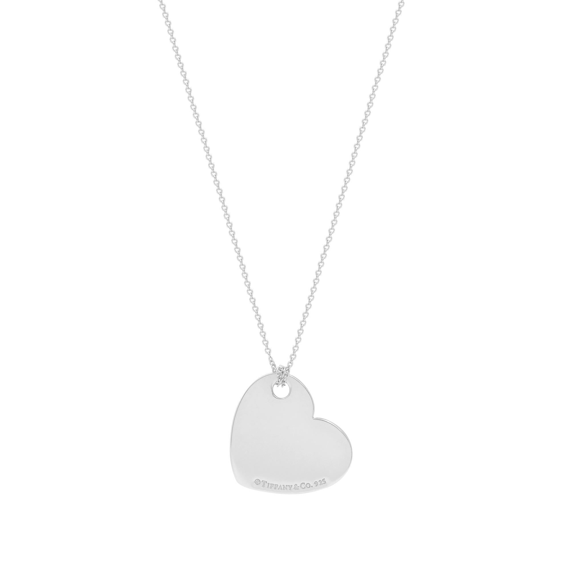 Simple yet elegant the Return to Tiffany heart pendant necklace designed in sterling silver 925. This corner hanging heart tag pendant comes with engraving on the front and stamped on the back. Necklace length: 15 Inches. Pendant Size: 23.8mm x