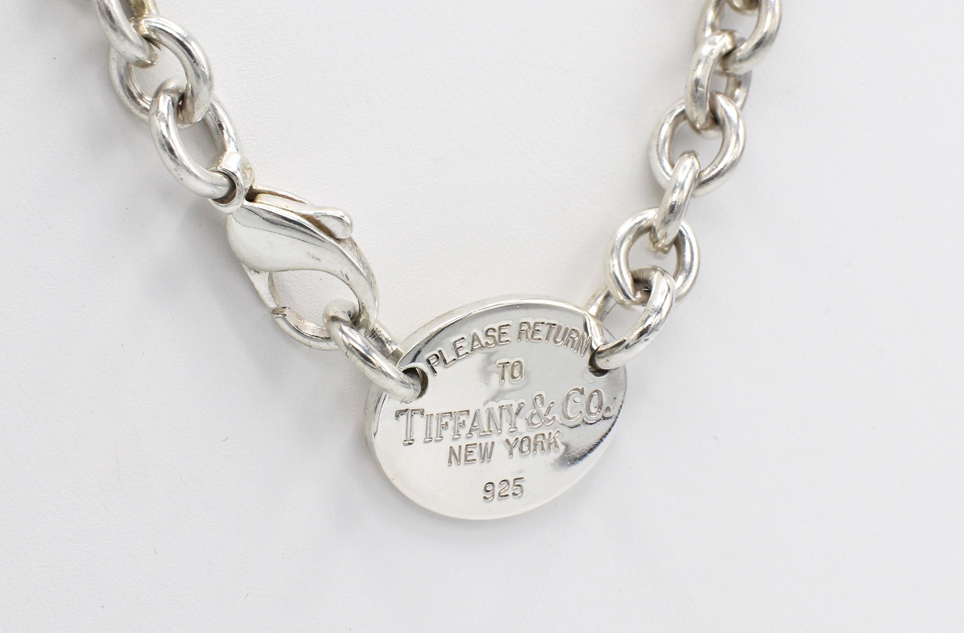 Tiffany & Co. Return to Tiffany Sterling Silver Oval Tag Link Chain Necklace 
Metal: Sterling silver
Weight: 51.6 grams
Links: 7.8mm
Length: 15.5 inches
Signed: 