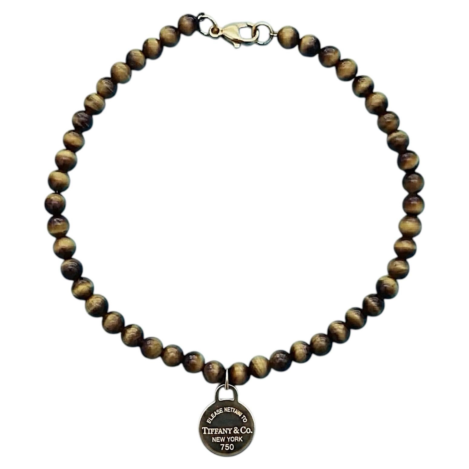 Tiffany & Co. Pulsera de cuentas de ojo de tigre «Return to Tiffany» con placa redonda de oro de 18 quilates en venta