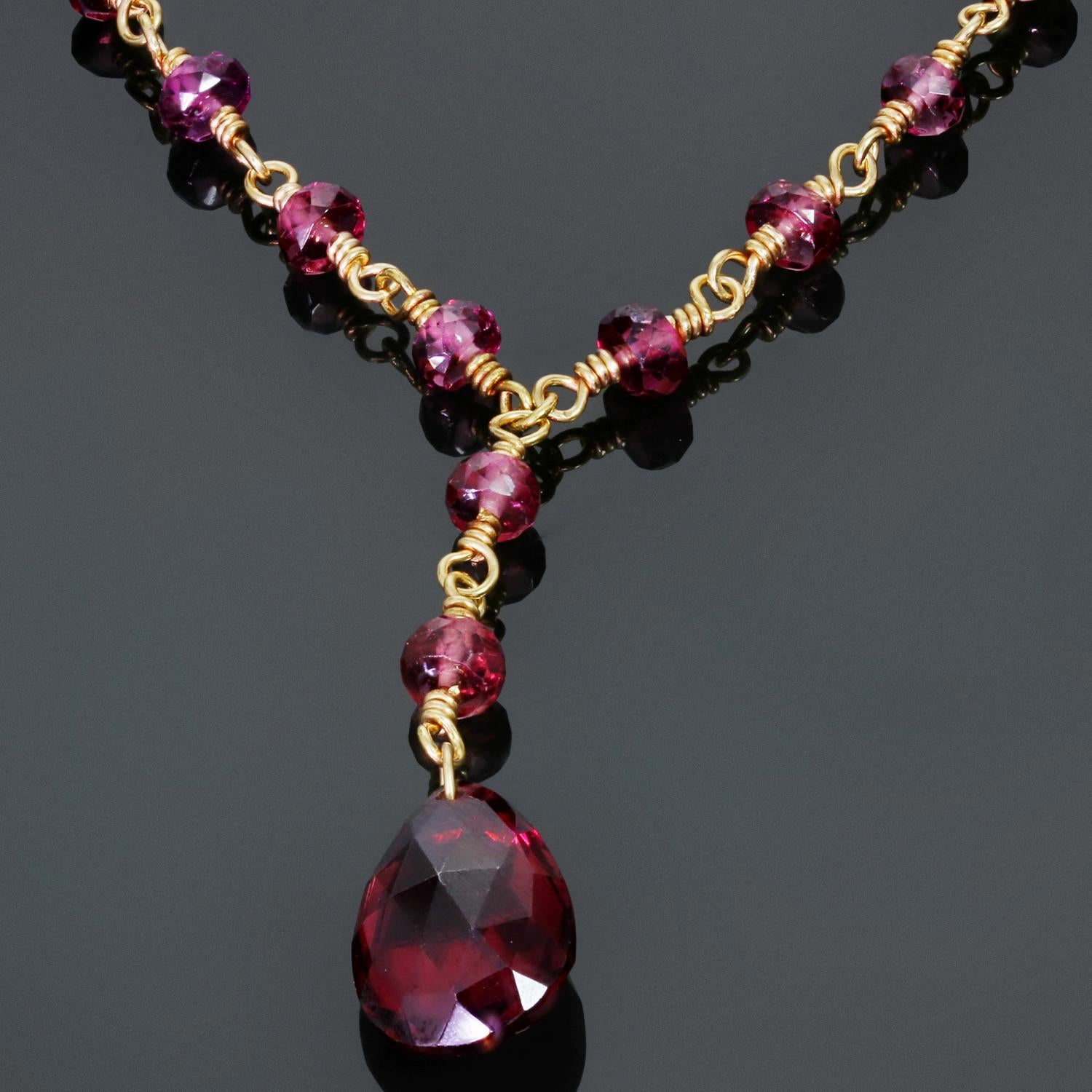 This gorgeous Tiffany & Co. pendant necklace features briolette beads crafted in rhodolite garnet and completed with an 18k white gold clasp. Made in United States circa 1990s. Measurements: 0.35