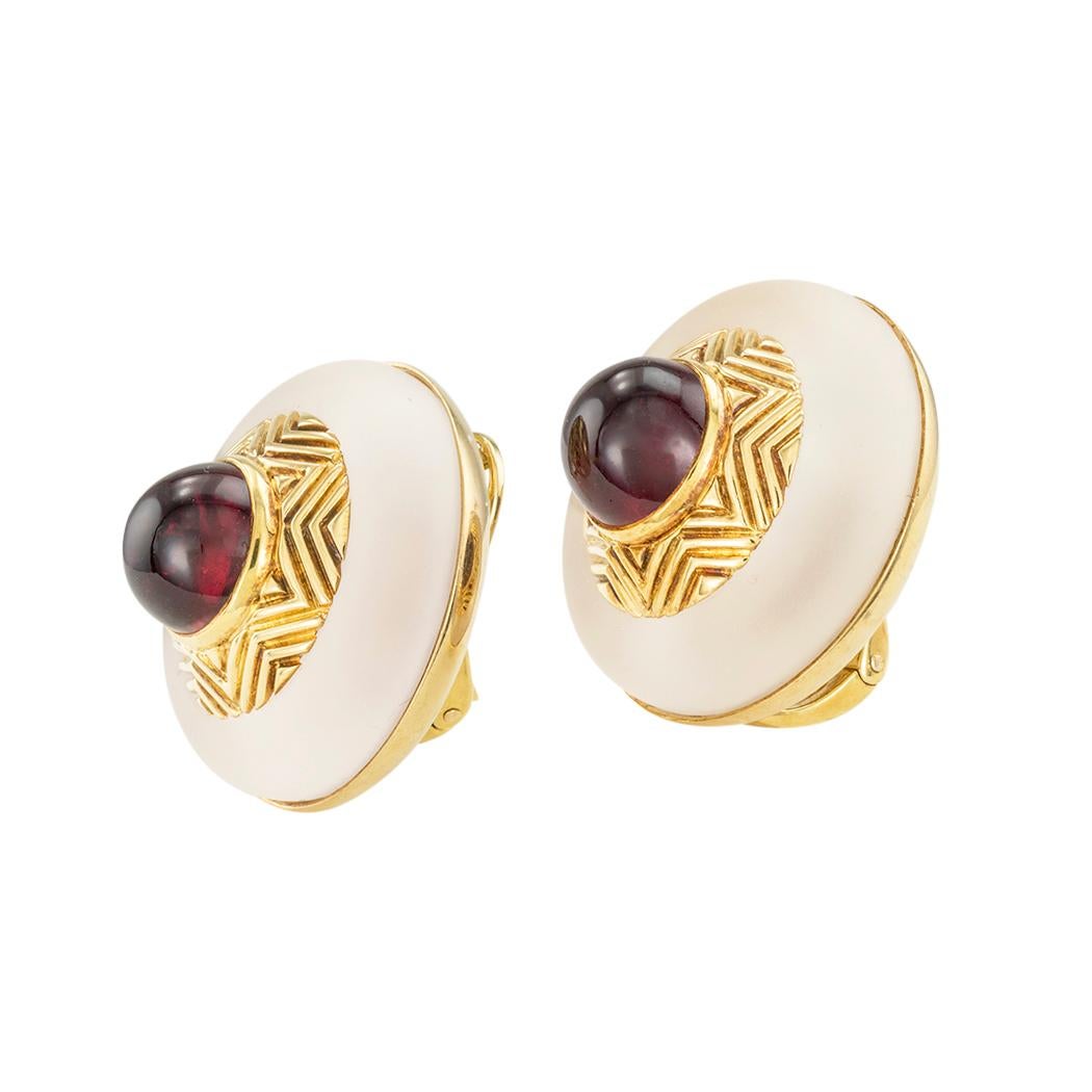 Tiffany & Co rock crystal garnet and gold clip-on earrings circa 1980.  Clear and concise information you want to know is listed below.  Contact us right away if you have additional questions.  We are here to connect you with beautiful and