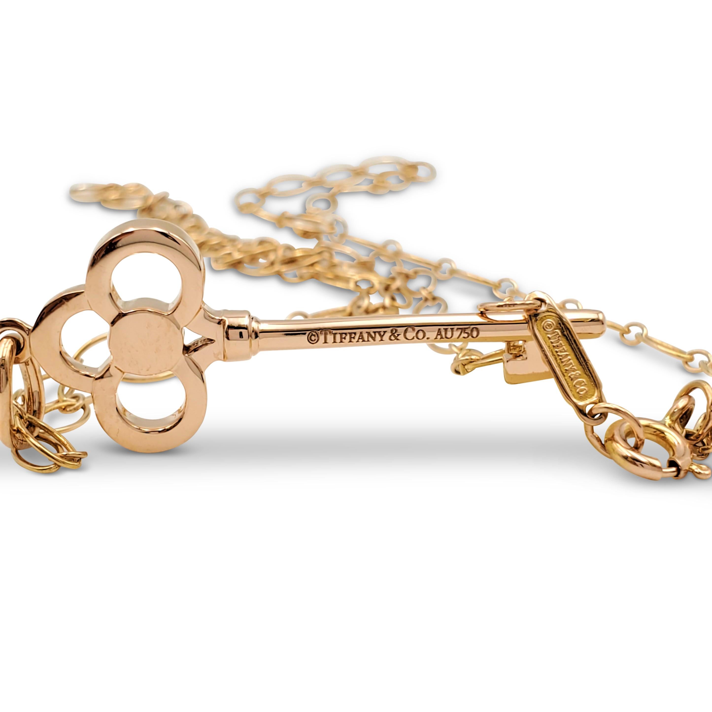 Round Cut Tiffany & Co. Rose Gold and Diamond 'Crown Key' Pendant Necklace