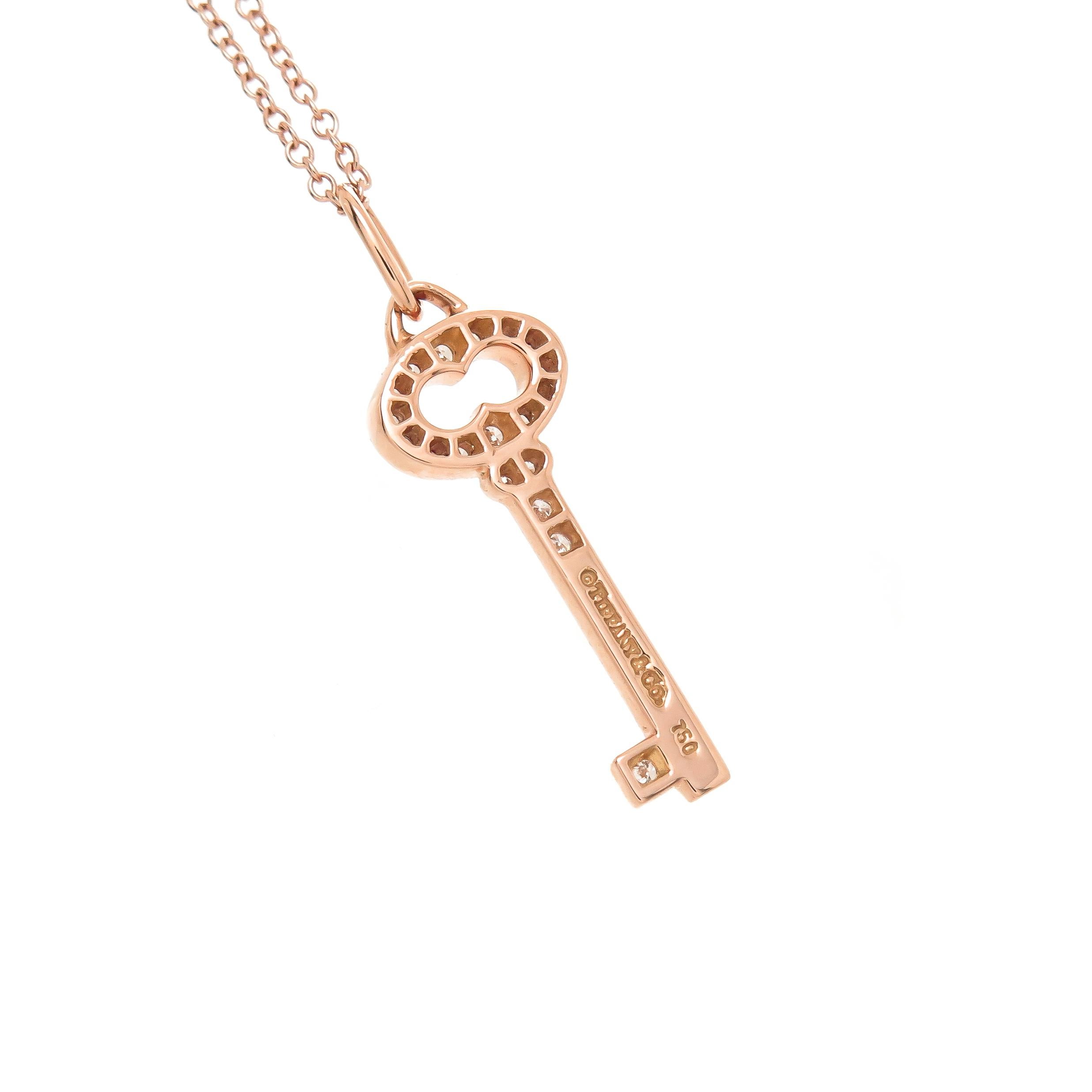 Circa 2017 Tiffany & Company 18K Rose Gold Key pendant necklace,  measuring 1 1/8 inches in length and set with Round Brilliant cut Diamonds totaling .15 Carat. Suspended from an 18 inch Rose Gold Chain, original Tiffany presentation box, New, never