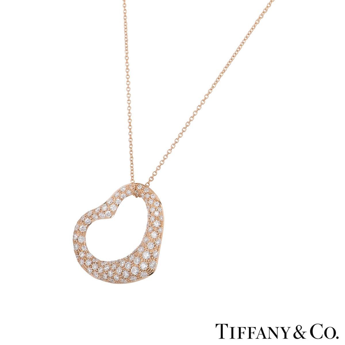 A beautiful 18k rose gold diamond heart necklace by Tiffany & Co. from the Elsa Peretti collection. The necklace comprises of an open work heart motif set with pave round brilliant cut diamonds. The diamonds have a total weight of approximately