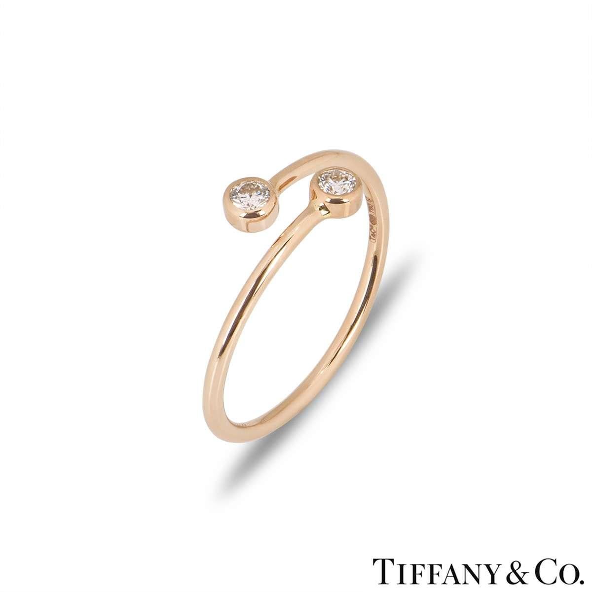 An 18k rose gold ring from the Elsa Peretti collection by Tiffany & Co. The ring features 2 round brilliant cut diamond set terminations, totalling 0.10ct. The ring is a size UK J½ / EU 49 / US 5 and has a gross weight of 1.0 gram.

The bangle comes