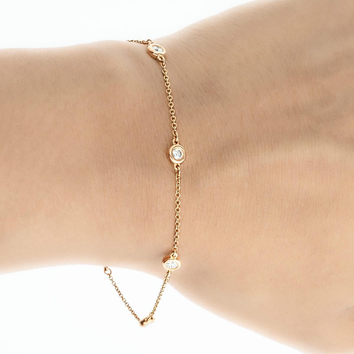 A beautiful rose gold diamond bracelet by Tiffany & Co. from their Elsa Peretti Diamonds By The Yard collection. The bracelet features 5 round brilliant cut diamonds weighing 0.35ct in total. Measuring 7.5 inches, the bracelet finishes with a spring