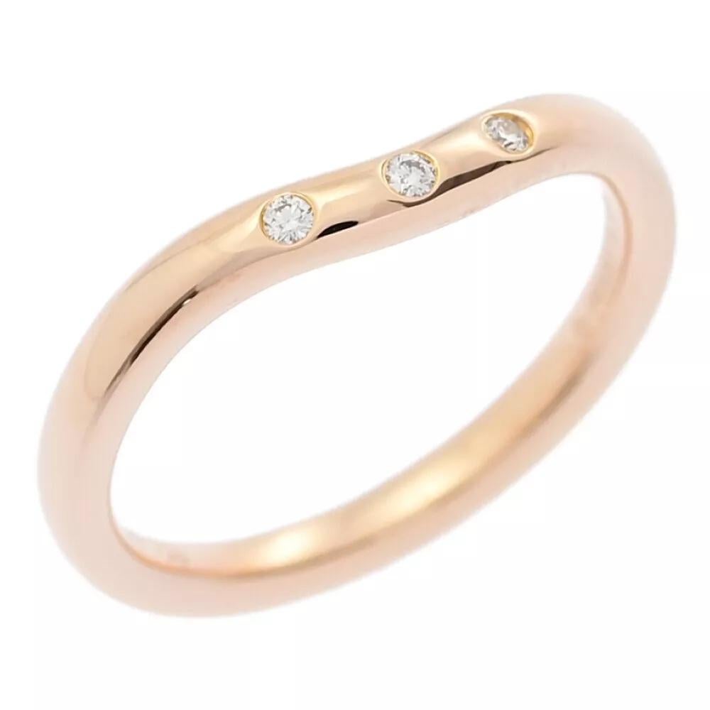 TIFFANY & Co. 18K Rose Gold Elsa Peretti 3 Diamond 2mm Curved Wedding Band Ring 4.5

Metal: 18K rose gold 
Size: 4.5
Weight: 2.60 grams
Width: 2mm
Diamond: 3 round brilliant diamond, carat total weight .03 
Hallmark: TIFFANY&Co. 750 ©PERETTI SPAIN