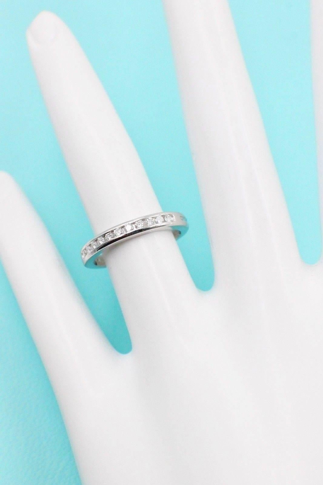 Tiffany & Co.
Style: Half Circle Diamond Wedding Band
Sku Number:  18408929
Size:  4 - sizable
Metal:  Platinum PT950
Total Carat Weight:  0.22 Cts.
Diamond Shape:  Round Brilliant 
Diamond Color & Clarity:  G-H  /  VVS-VS
Hallmark:  