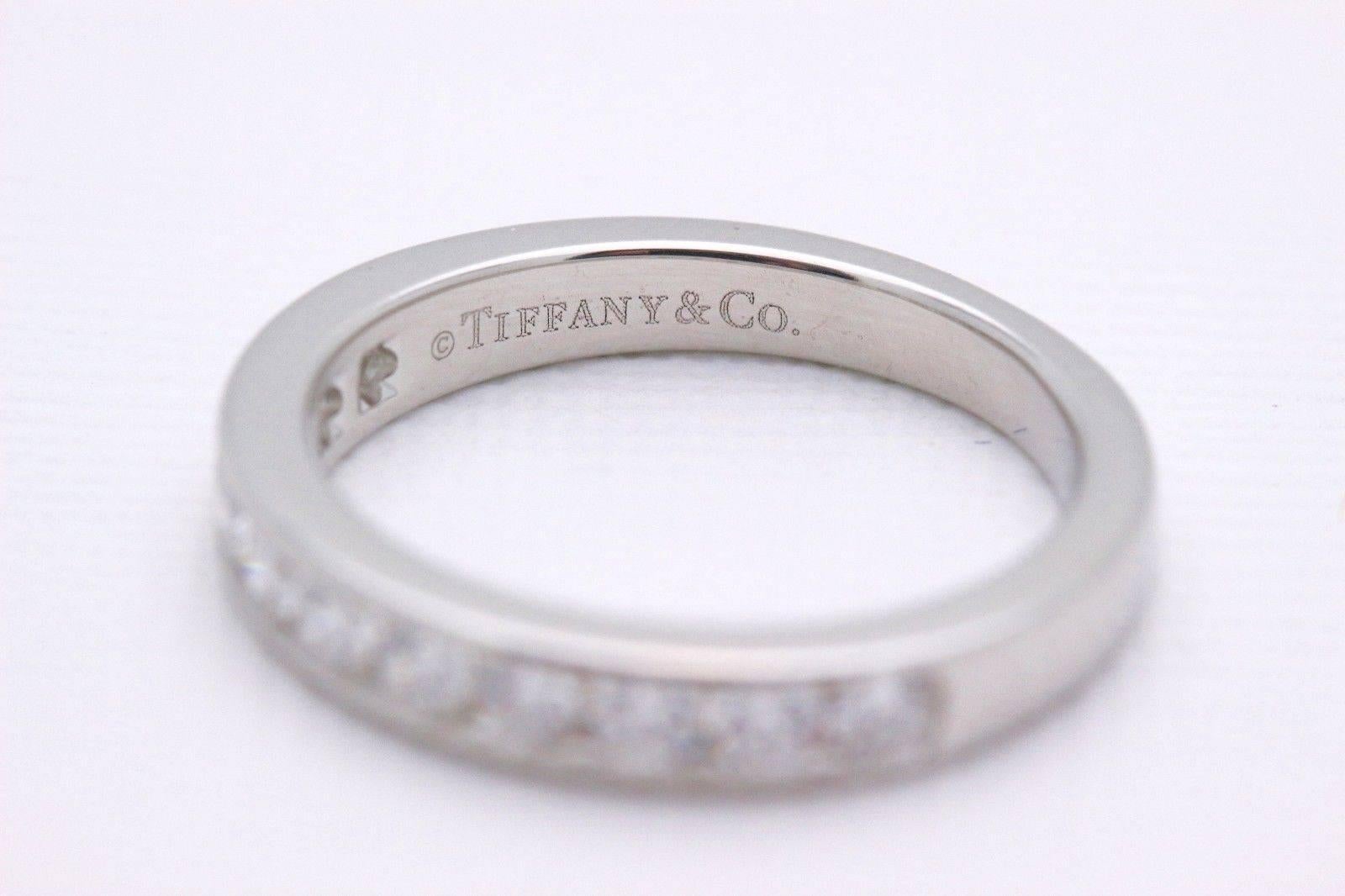 Tiffany & Co.
Style: Half Circle Diamond Wedding Band
Sku Number:  16183334
Metal:  Platinum PT950
Total Carat Weight:  0.24 Cts.
Diamond Shape:  Round Brilliant 
Diamond Color & Clarity:  F / VS
Hallmark:  