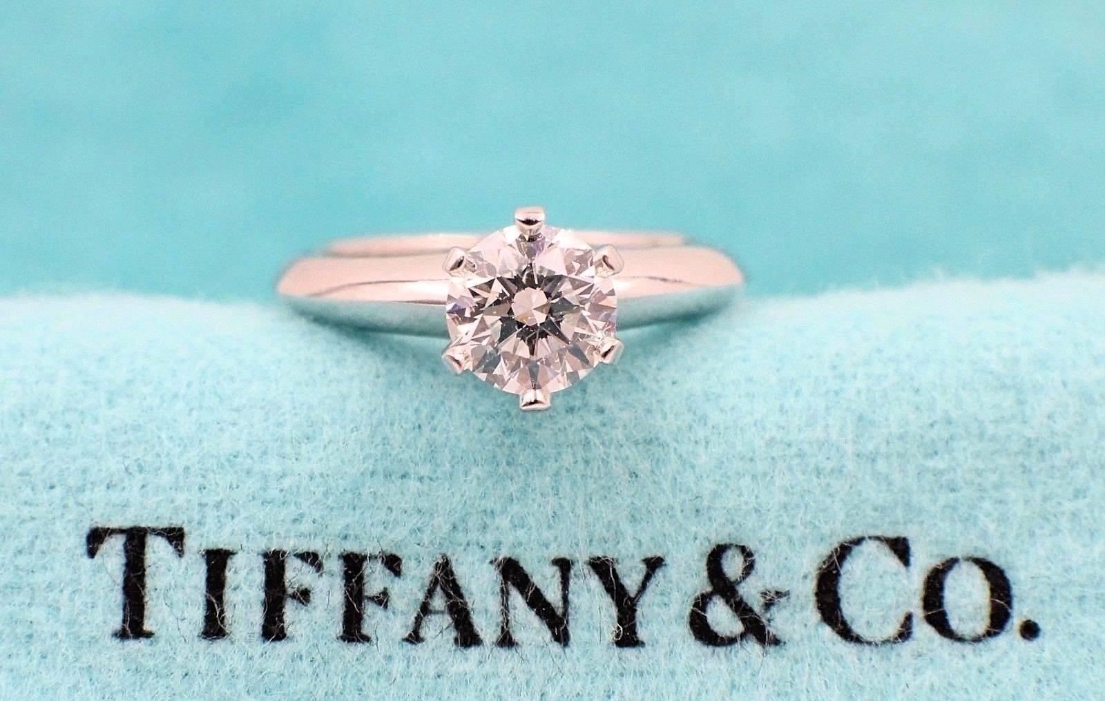 Tiffany & Co.
Style:  Classic Tiffany Solitaire Engagement Ring
Serial Number: 26895391
Metal: Platinum PT950
Size:   3 - sizable
Total Carat Weight: 0.75 CTS
Diamond Shape: Round Brilliant
Diamond Color & Clarity: H / VS1
Hallmark: 