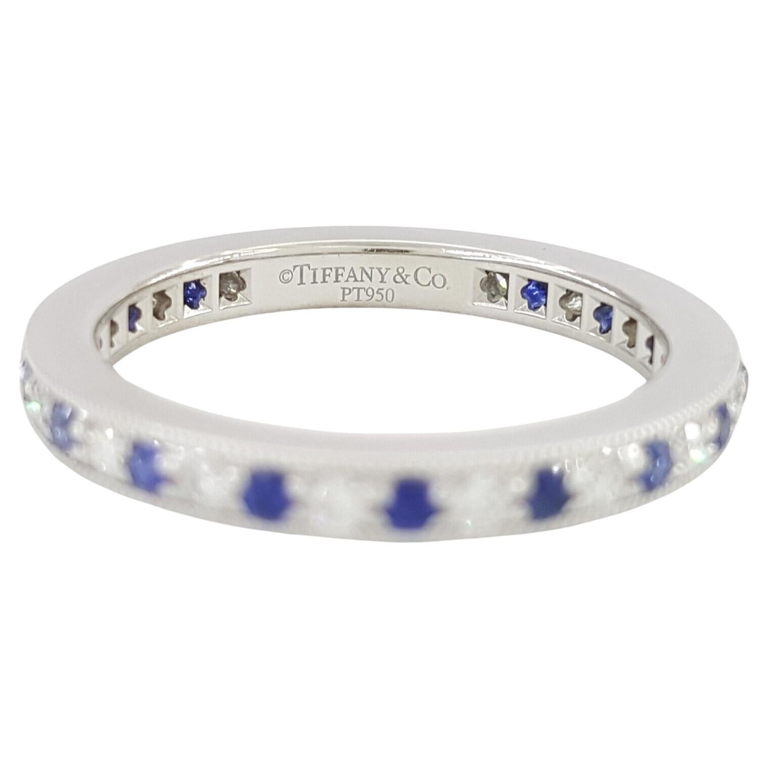  Tiffany & Co 0.57 ct Total Weight Round Brilliant Cut Diamond & Blue Sapphire Channel Set Platinum Full Circle Eternity Wedding / Anniversary Band / Ring.

The ring weighs 3.7, size 4.5, contains 18 Natural Round Brilliant Cut Diamonds weighing