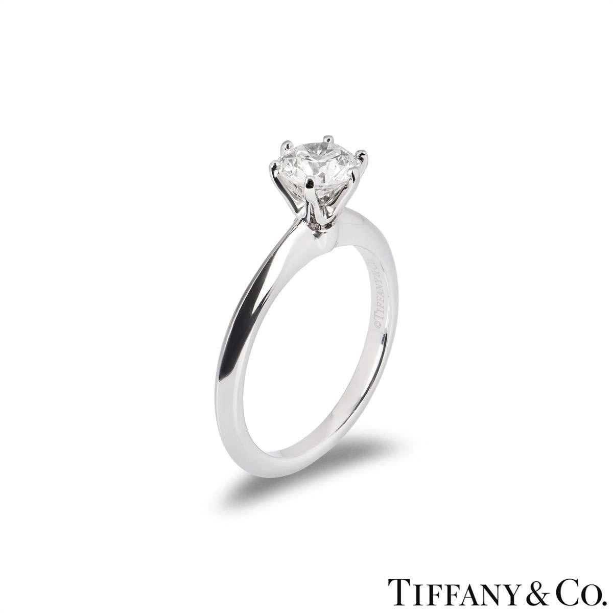 A beautiful platinum diamond ring by Tiffany & Co. from The Setting collection. The ring comprises of a round brilliant cut diamond in a 6 claw setting with a weight of 0.86ct, H colour and VVS1 clarity. The diamond scores an excellent rating in all