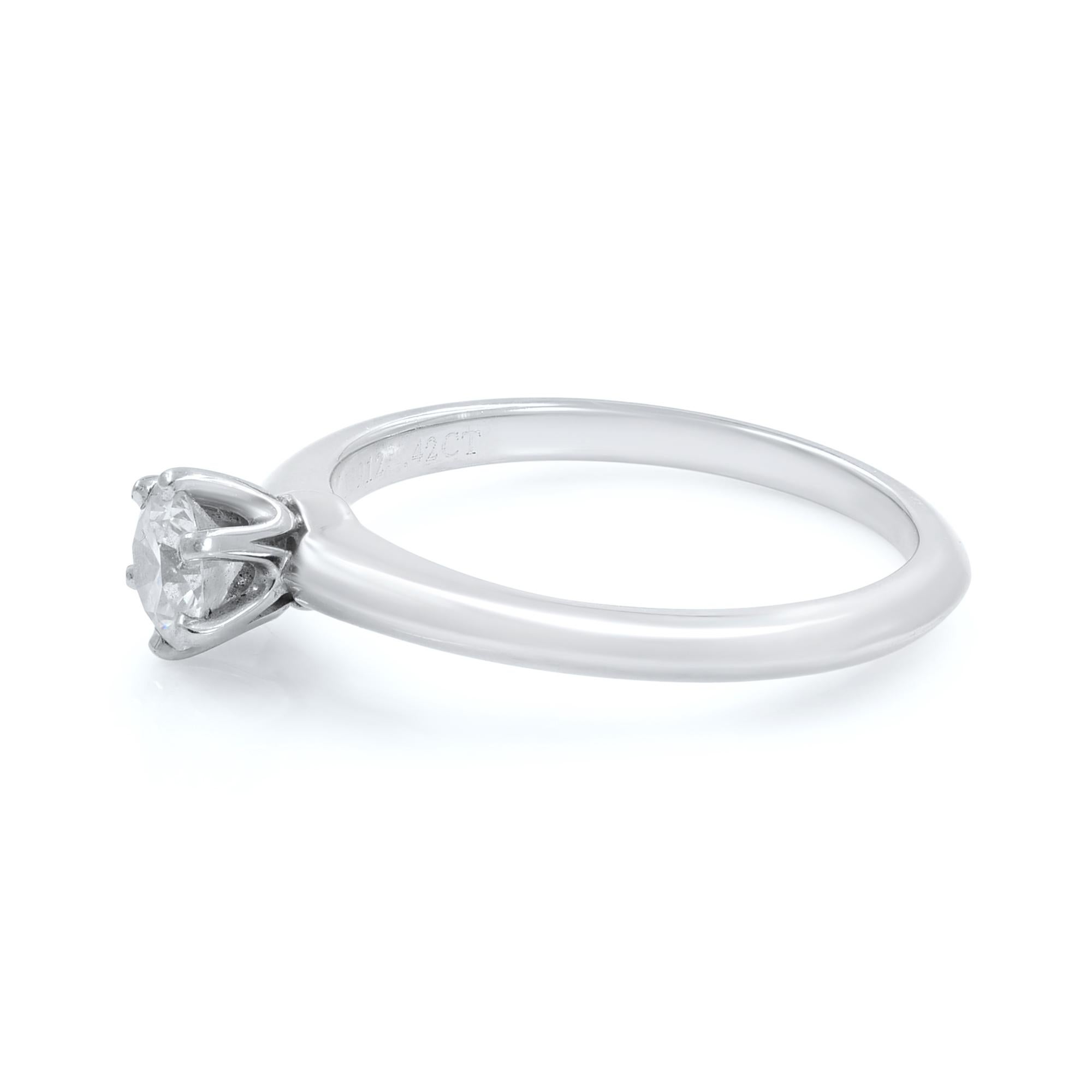 Pre-owned solitaire diamond ring. Excellent condition!
Popular knife edge classic Solitaire diamond engagement ring from Tiffany & Co. 
Round Cut: 0.42ct 
Six Prong Setting. 
Comes with Tiffany pouch. 
Size 6.5