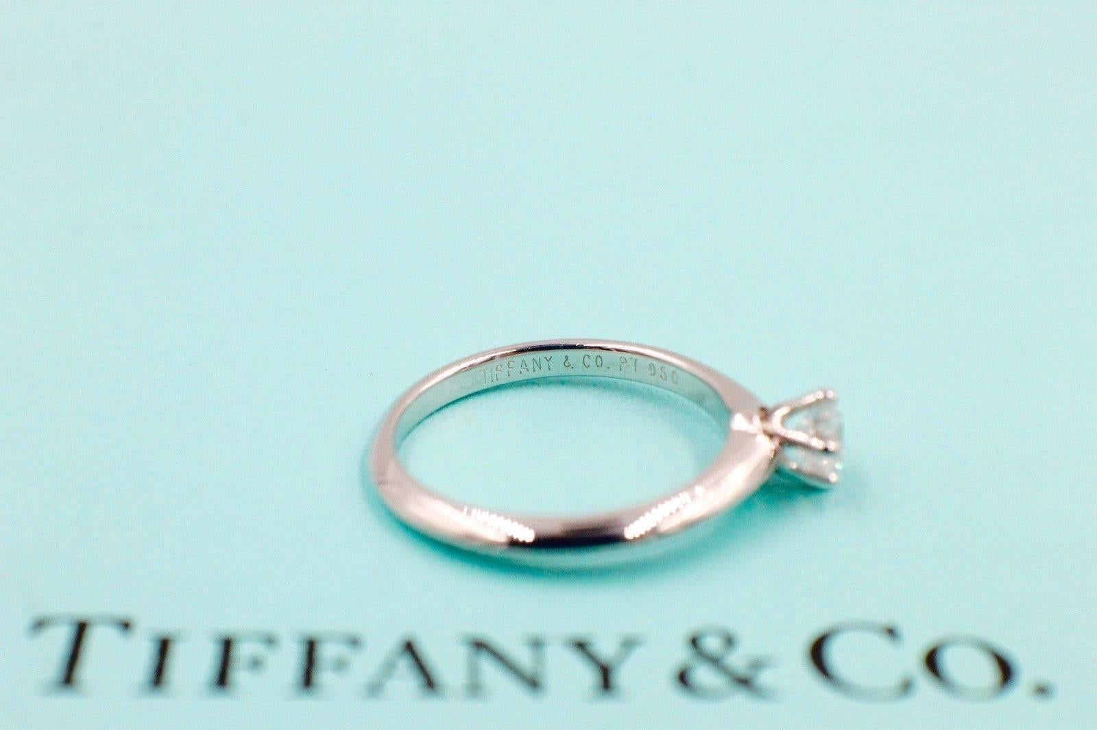 Tiffany & Co.
Style:  Solitaire Engagement Ring
Serial Number:  16428698
Metal:  Platinum PT950
Size:  4.25 - sizable 
Total Carat Weight:  0.28 TCW
Diamond Shape:  Round Brilliant Diamond 0.28 CTS
Diamond Color & Clarity:  D / IF
Hallmark: 
