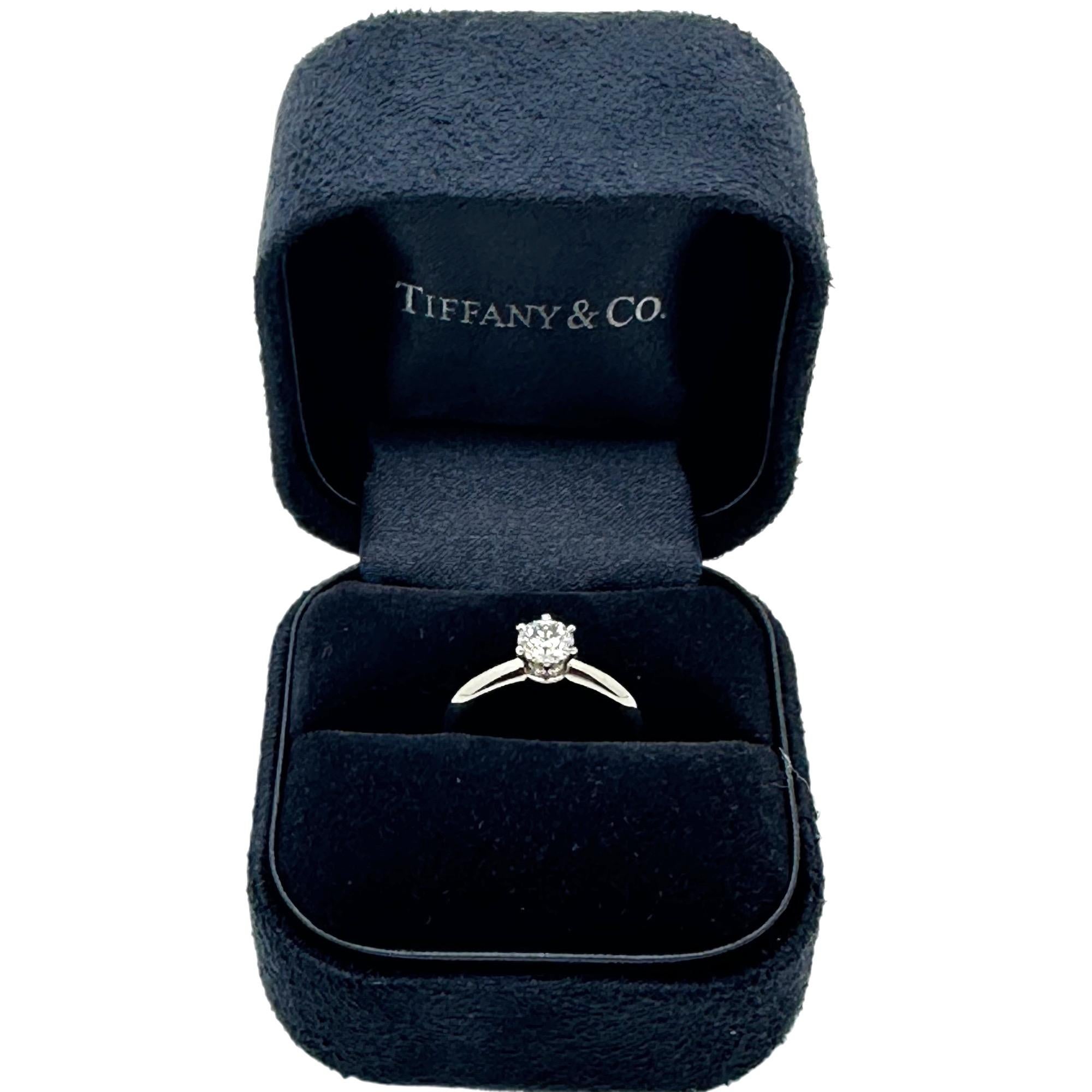 Tiffany & Co Round Brilliant Diamond Solitaire Engagement Ring
Style:  Solitaire 
Ref. number:  T42744
Metal:  Platinum Pt950
Size:  3.75
TCW:  0.41 cts
Main Diamond:  Round Brilliant Diamonds
Color & Clarity:  E - VS1
Hallmark:  TIFFANY&CO PT950