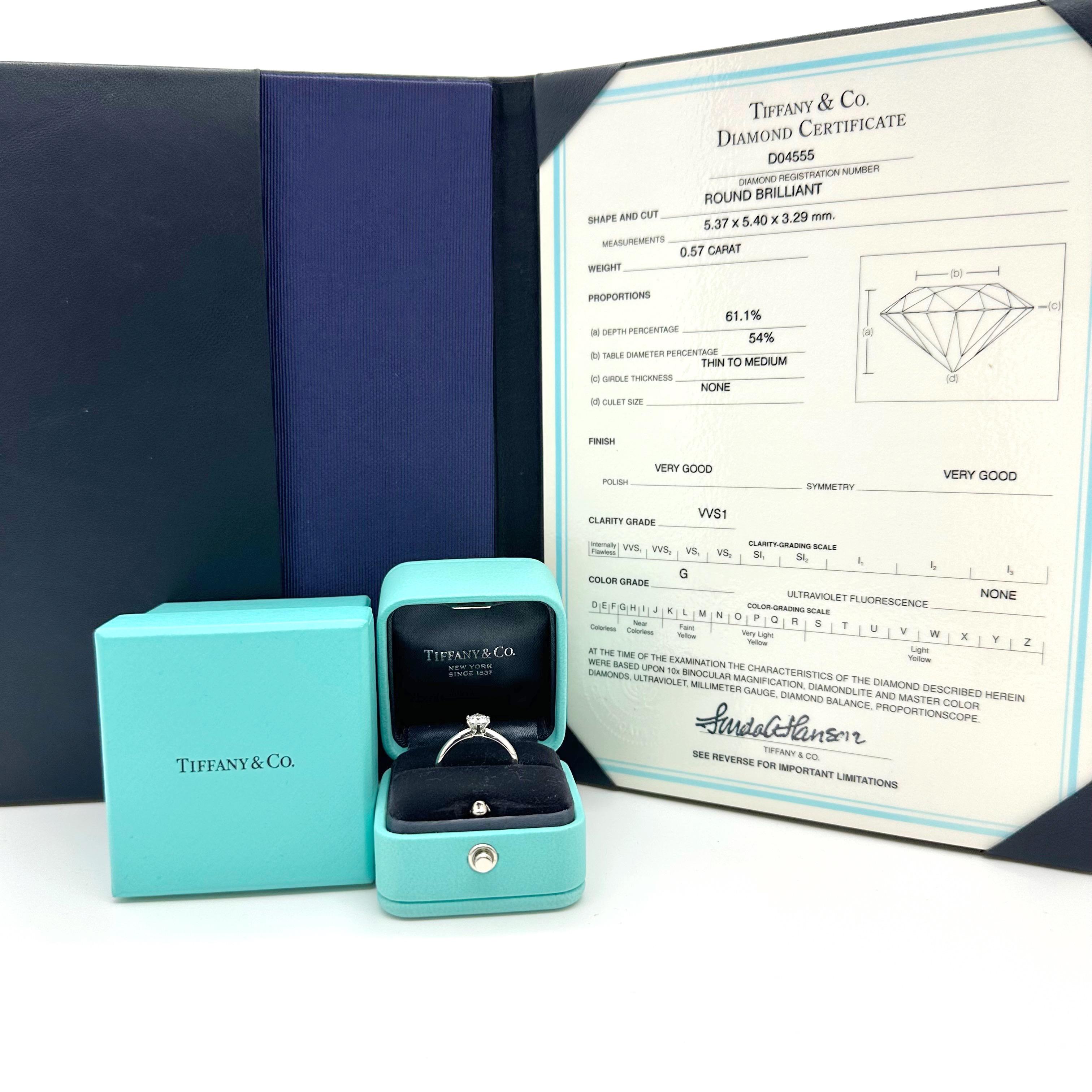 Tiffany & Co Solitaire Engagement Ring
Style: Six-Prong
Ref. number: D04555
Metal: Platinum PT950
Size / Measurements: 6.5 - sizable
TCW: 0.57 cts
Main Diamond: Round Brilliant Cut
Color & Clarity: G Color, VVS1 Clarity
Hallmark: ©TIFFANY&CO PT950