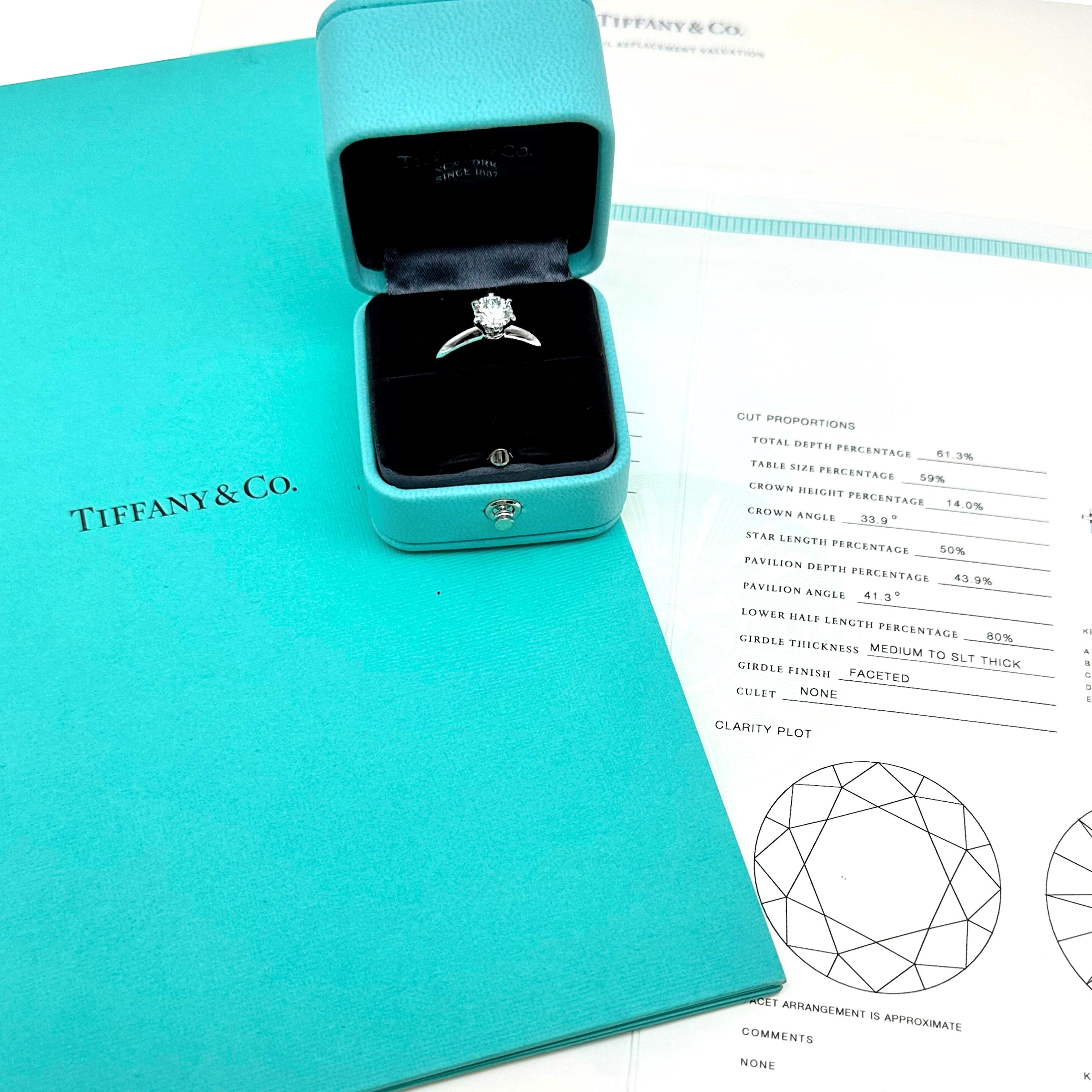 Tiffany & Co. Round Diamond 1.05 cts Solitaire Engagement Ring
Style:  6-Prong Tiffany Setting
T&C Number:  28272634/M03240373
Metal:  Platinum PT950
Size:  5.75 - sizable
TCW:  1.05 cts
Main Diamond:  Round Brilliant Diamond
Color & Clarity:  I,