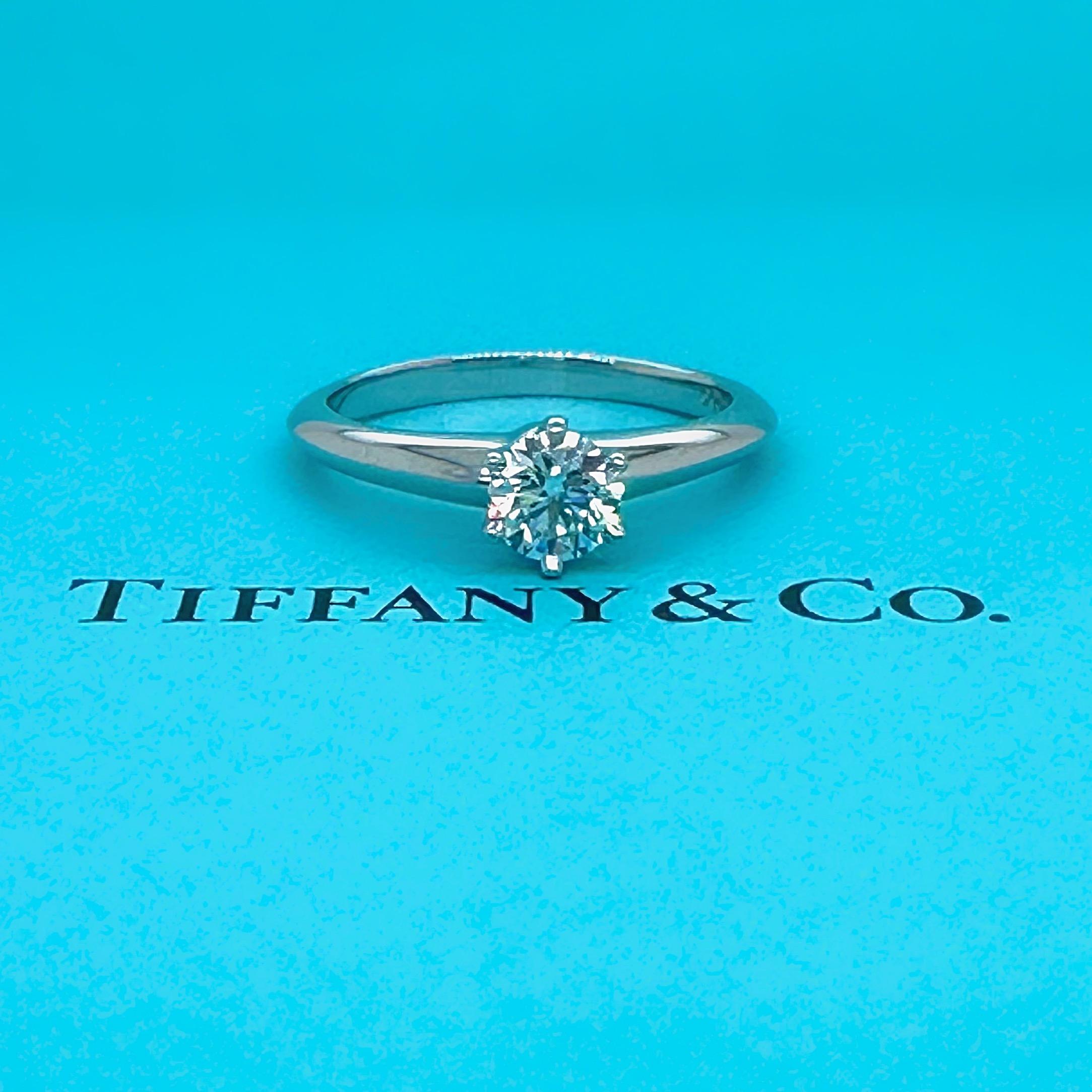 Tiffany & Co. Tiffany Setting Round Diamond Engagement Ring
Style:   6 Prong Tiffany Solitaire
Ref. number:  28262221
Metal:  Platinum PT950
Size:  4.5 sizable
Main Diamond:  Round Brilliant Diamond 0.37 cts
Color & Clarity:  F, VVS1
Hallmark: 