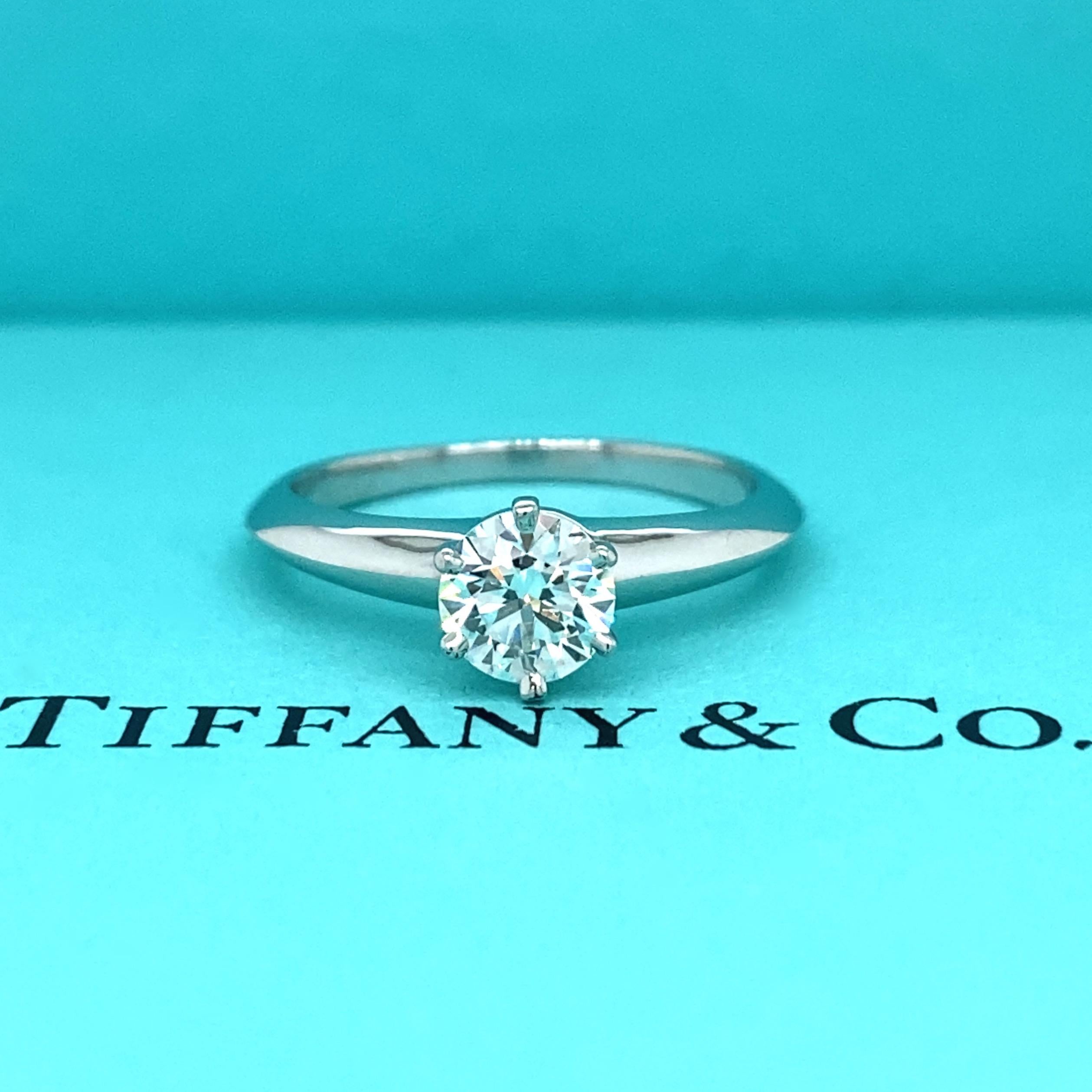 Tiffany & Co Solitaire Engagement Ring
Style:  Classic 6-Prong 
Ref. number:  18617595/E12230183
Metal:  Platinum PT950
Size:  6 sizable
TCW:  0.60 cts
Main Diamond:  Round Brilliant Cut
Color & Clarity:  I / VVS1 
Hallmark:  ©TIFFANY&CO. PT950