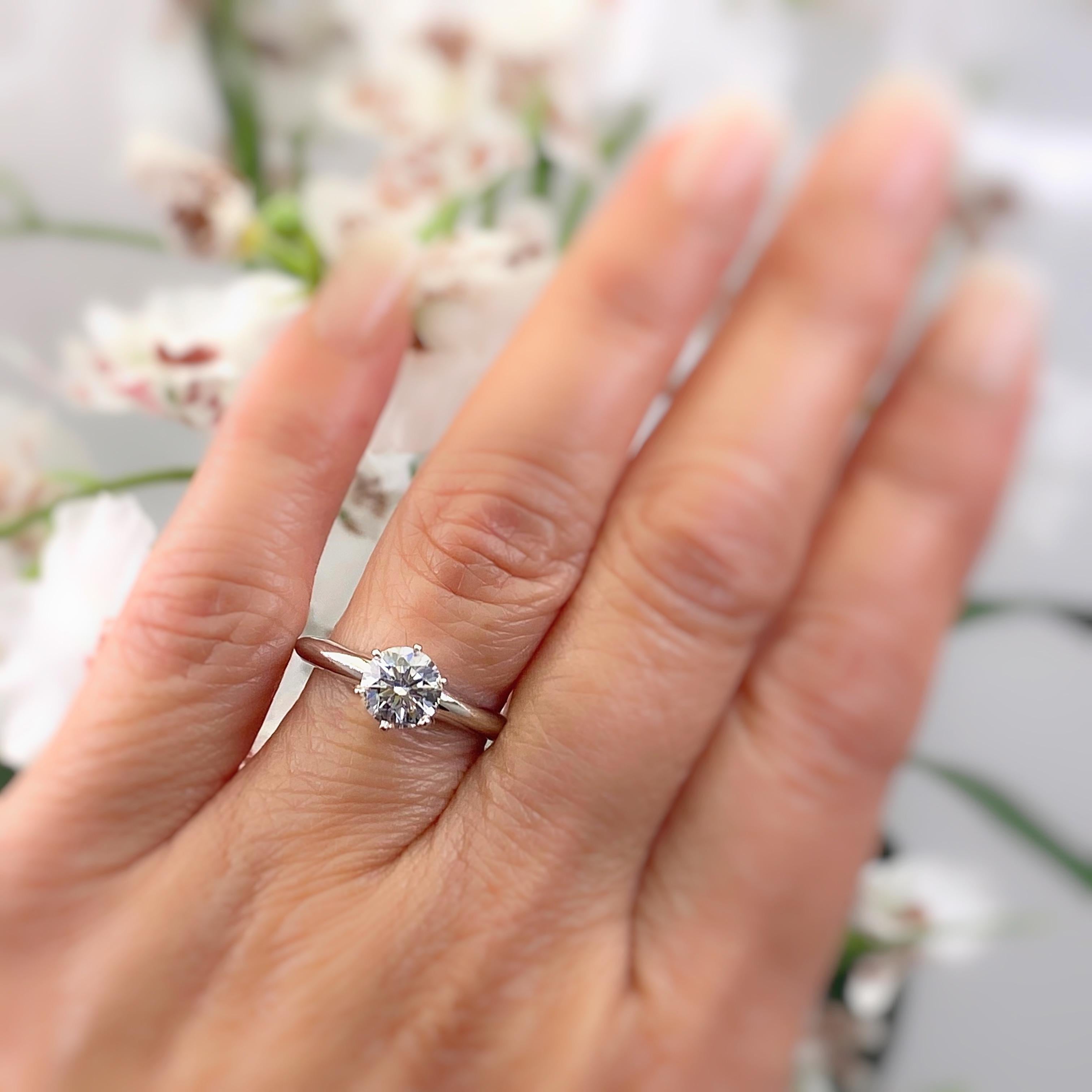 Tiffany & Co. Solitaire Engagement Ring
Style:  Classic 6-Prong Solitaire
Metal:  Platinum PT950
Size:  5.75 - sizable
TCW:  1.03 cts
Main Diamond:  Round Brilliant Diamond 1.03 cts
Color & Clarity:  G / VS1
Hallmark:  ©TIFFANY&CO.PT950 32835052