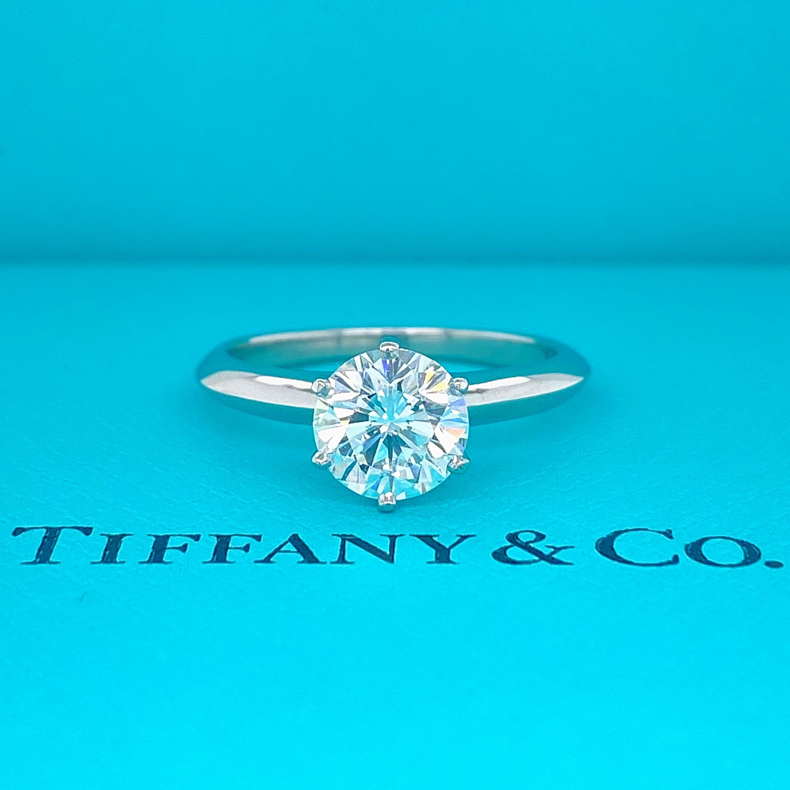 Tiffany & Co Solitaire Engagement Ring
Style:  Classic 6-Prong 
Ref. number:  D48268
Metal:  Platinum PT950
GIA:  11041985
Size:  5.75 sizable
TCW:  1.31 cts
Main Diamond:  Round Brilliant Cut
Color & Clarity:  E / VS1 
Hallmark:  TIFFSNY&CO. PT950 