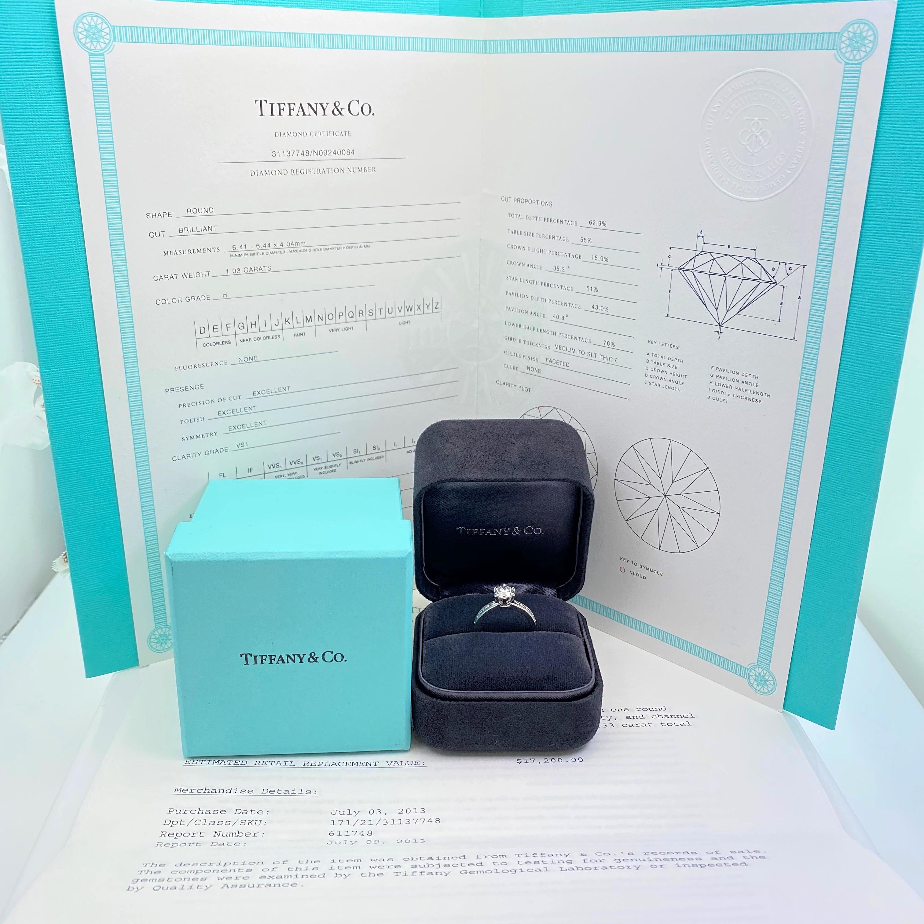 Tiffany & Co Diamond Engagement Ring
Style:  Tiffany Setting with Channel-Set Diamond Band
T&C Diamond Certificate:  31137748/N09240084
Metal:  Platinum PT 950
Size:  6 - sizable
TCW:  1.36 tcw
Main Diamond:  Round Brilliant Diamond 1.03 cts
Color &