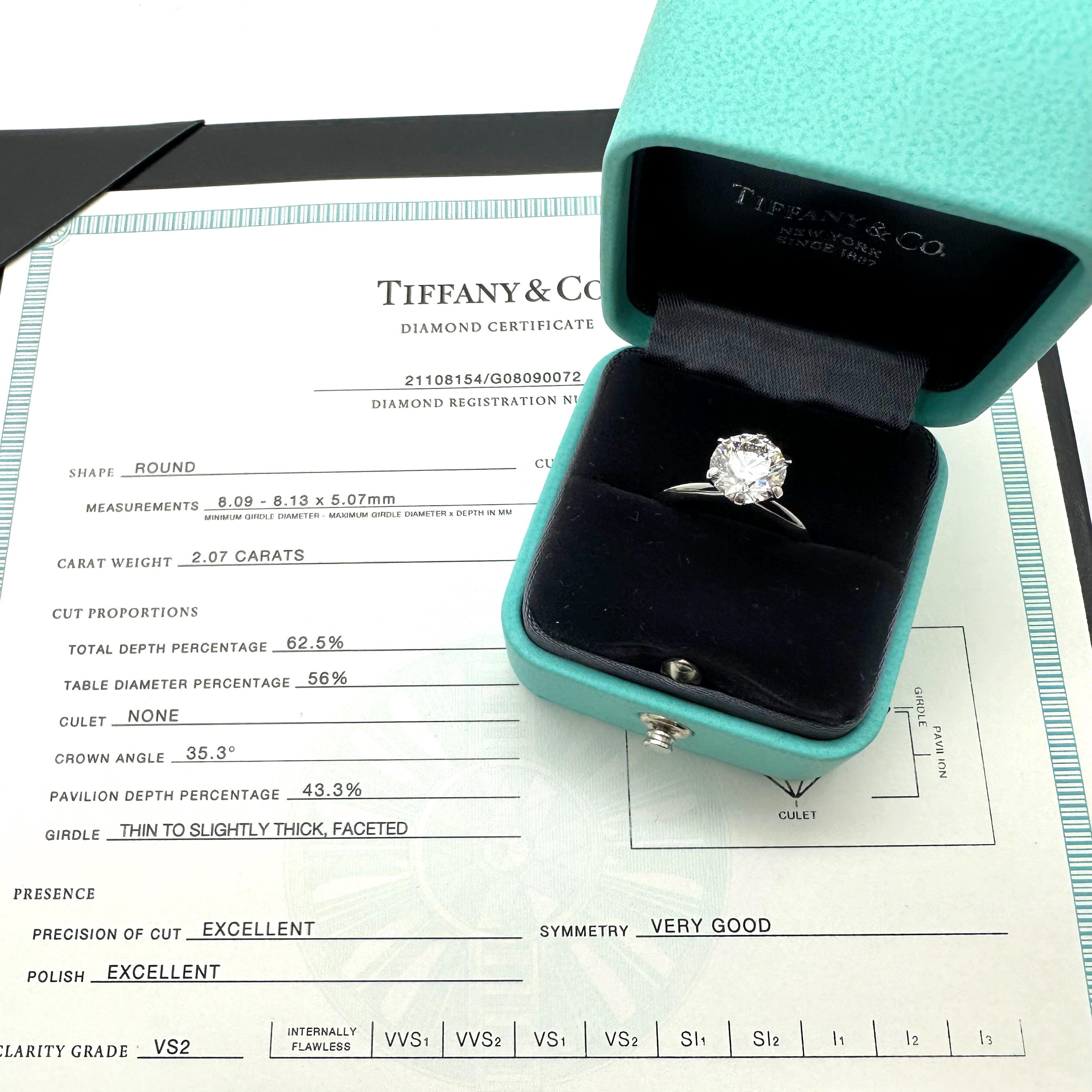 Tiffany & Co Round Diamond Tiffany Setting Engagement Ring
Style: Six-Prong Solitaire 
Ref. number: 21108154/G08090072
Metal: Platinum PT950
Size / Measurements: 5.5 - sizable
TCW: 2.07 cts
Main Diamond: Round Brilliant Cut
Color & Clarity: H Color,