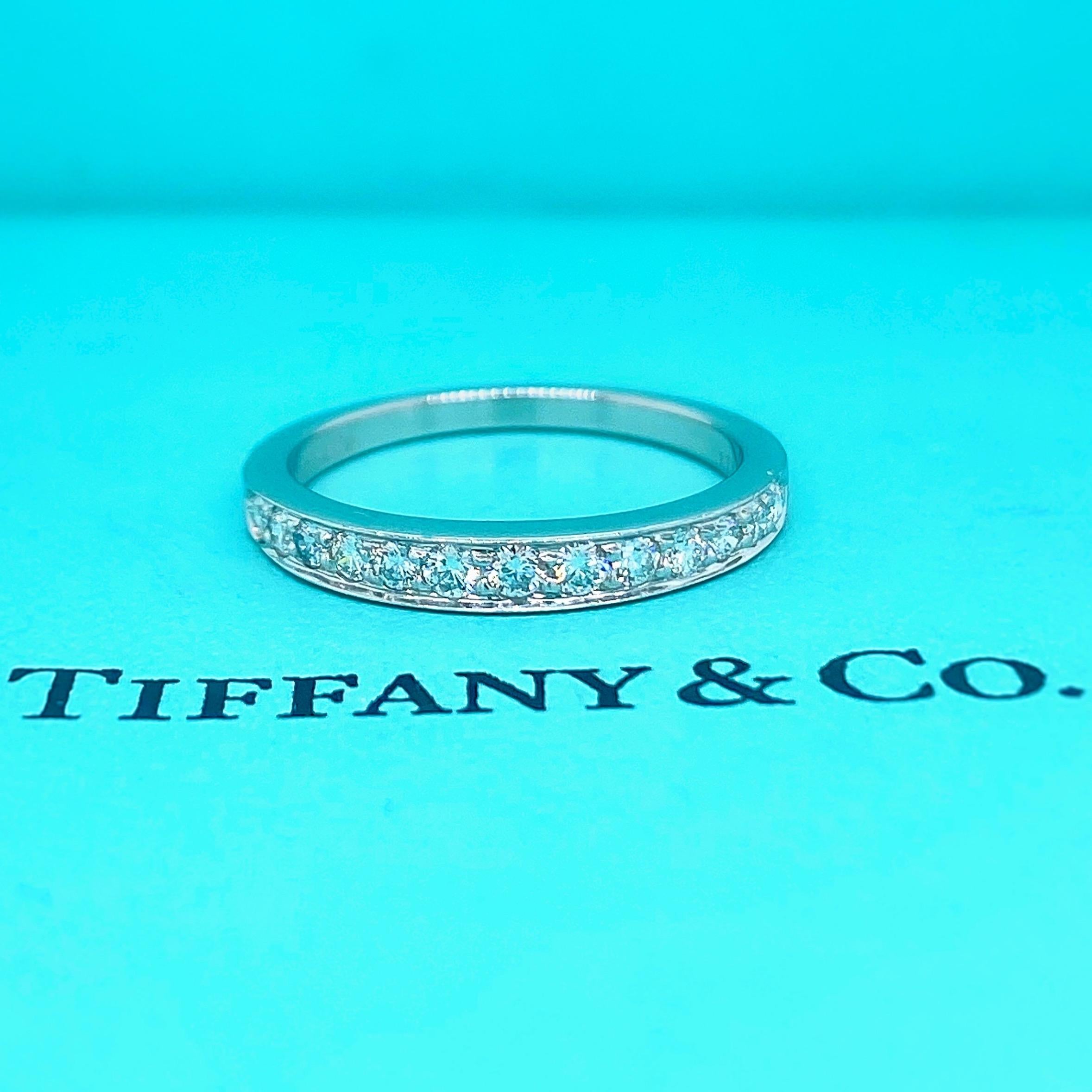 Tiffany & Co. Diamond Wedding Band Ring
Style:  Half-Circle Bead Set 
Metal:  Platinum PT950
Size:  5.25 - sizable
Measurements:  2.75 MM
TCW:  0.27 tcw
Main Diamond:  13 Round Brilliant Diamonds
Color & Clarity:  F - G / VS1
Hallmark:  ©TIFFANY&CO.