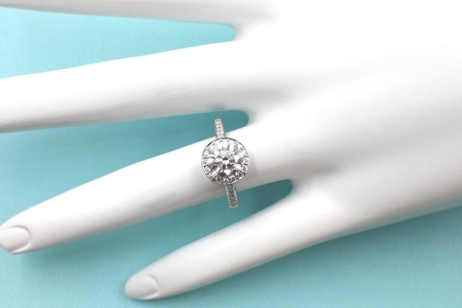Tiffany & Co Platinum and Diamond Single Row Halo, set with One Round Brilliant Cut Diamond 1.29 CTS, G color, VS2 clarity with a crown inscription of 