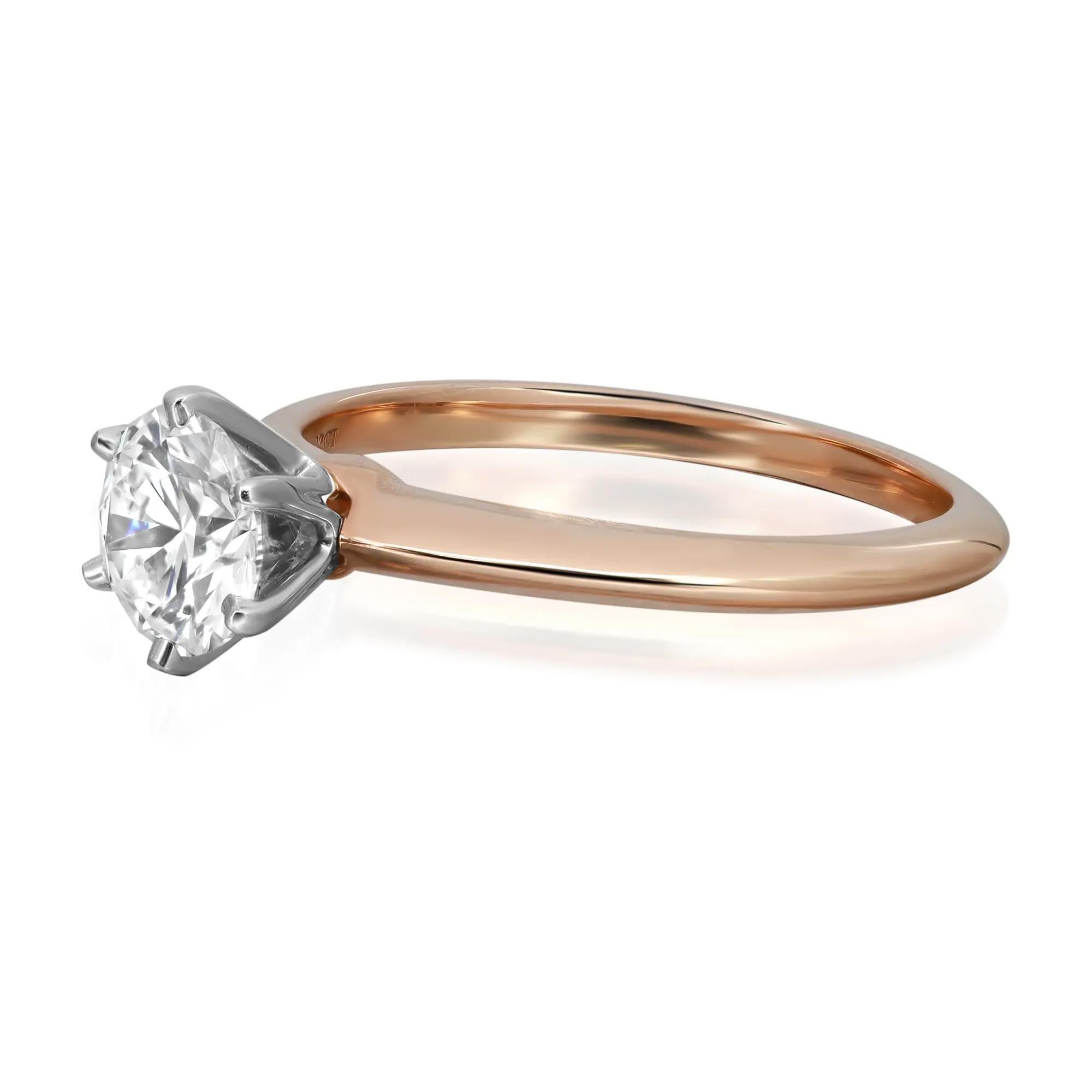 Beautiful Tiffany & Co. solitaire six prongs diamond engagement ring crafted in 18K Yellow gold band with platinum prongs, encrusted with center round brilliant cut diamond weighing 0.82 carat. Diamond quality: F color and VS1 clarity. Hallmarked