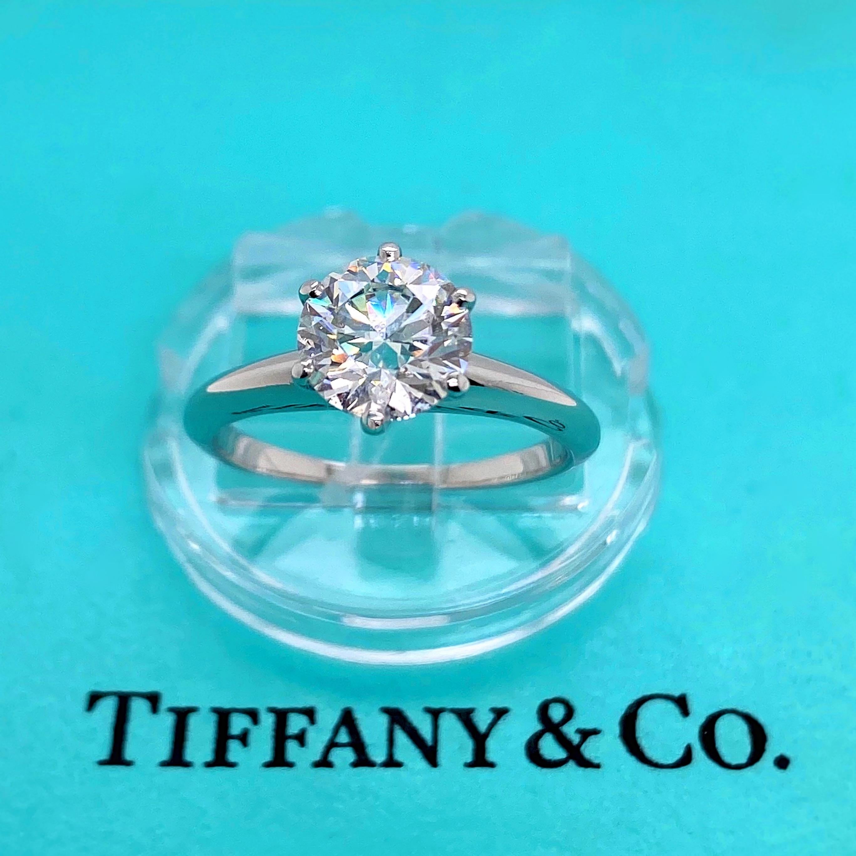 Tiffany & Co Classic Solitaire Engagement Ring
Style:  6-Prong Solitaire
Ref. number:  17412981/D06260174
Metal:  Platinum PT950
Size:  5 - sizable
TCW:  1.27 cts
Main Diamond:  Round Brilliant Diamond
Color & Clarity:  G - VS1
Hallmark: 