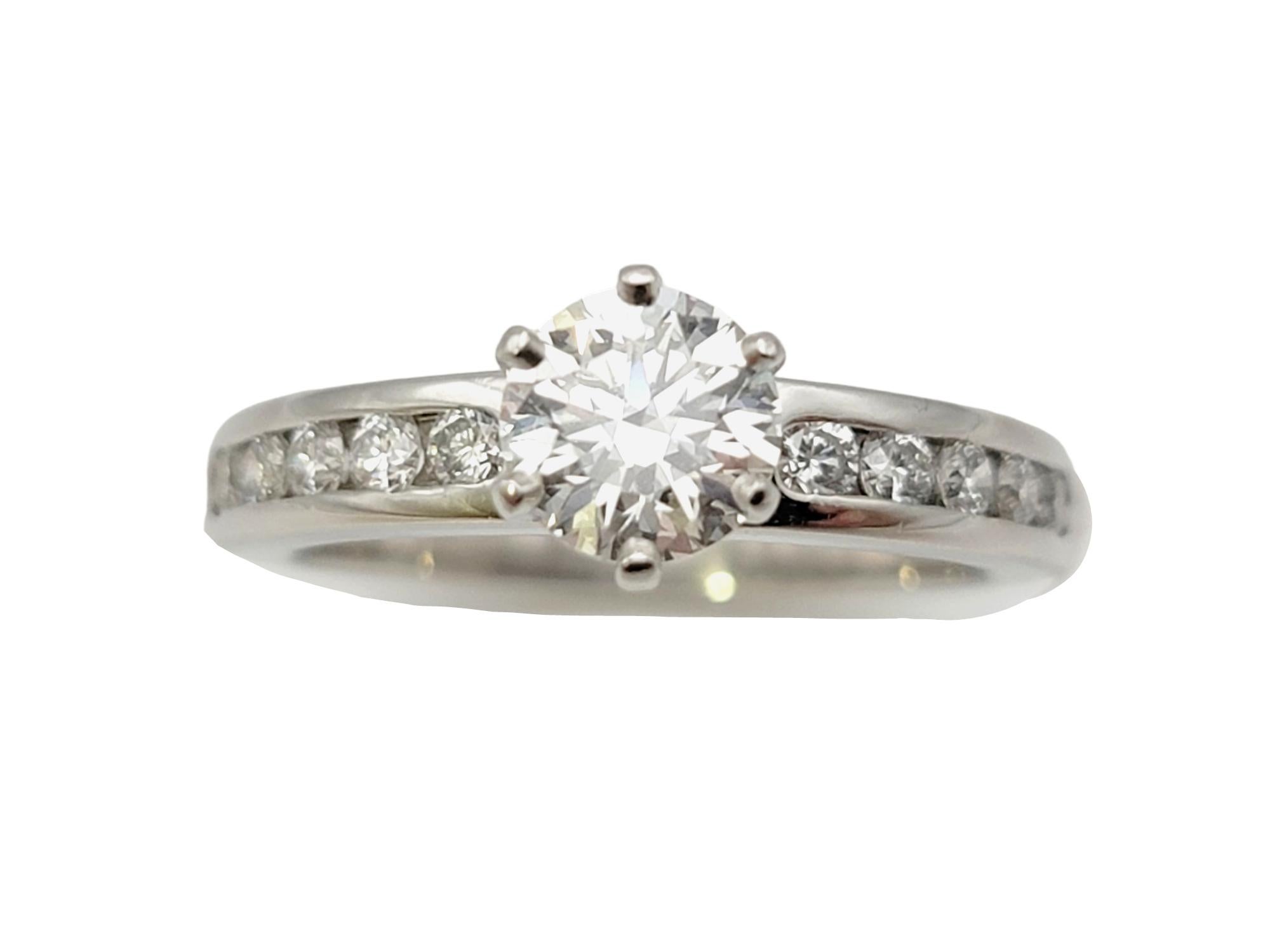 Ring size: 5.75

Say yes to this incredible diamond solitaire engagement ring from Tiffany & Co.! This classic Tiffany engagement ring gets a little modernized update with the addition of glittering diamonds along the shank, adding even more sparkle